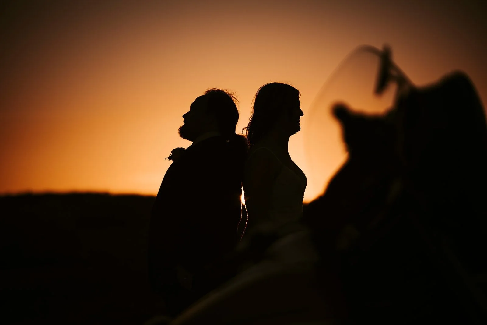 BurnTheScript-Bride-and-groom-in-sunset-with-motorbike.JPG