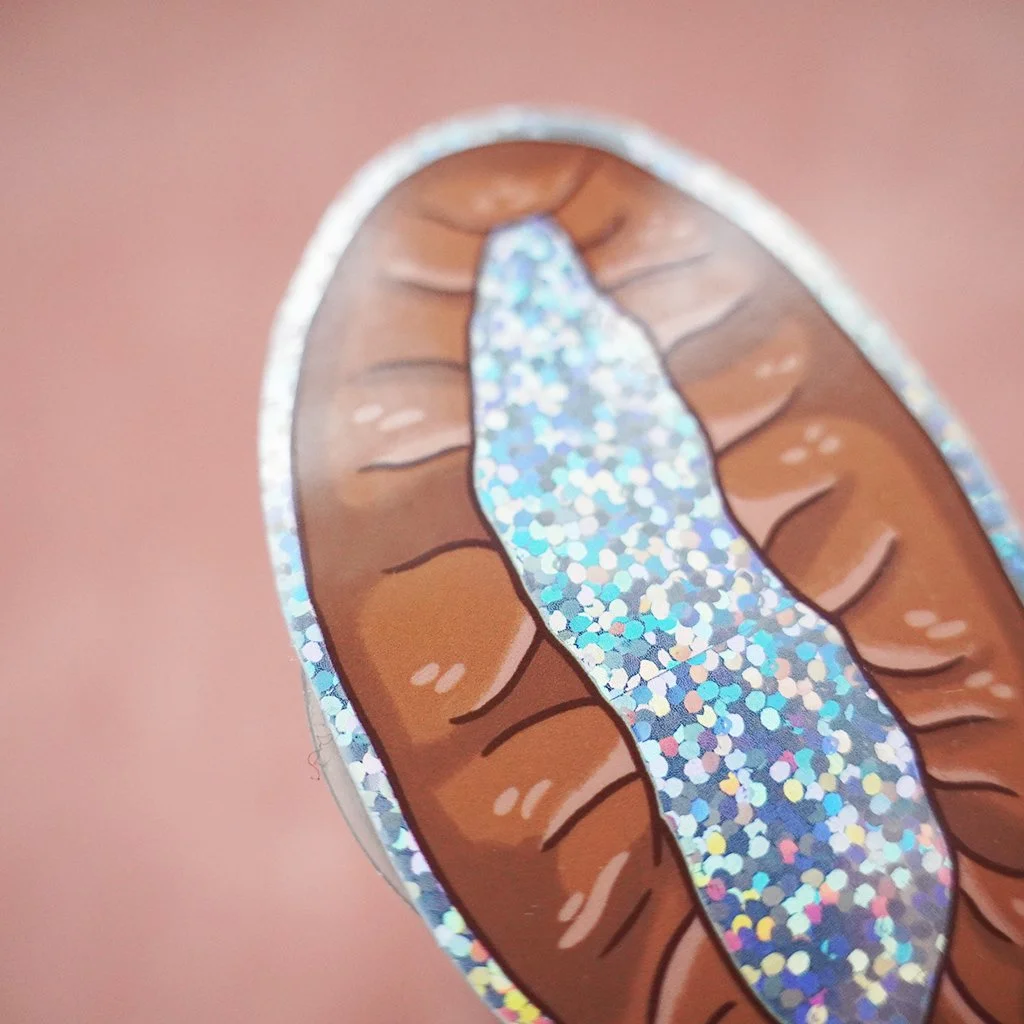 Piirretty kaukosauva, jossa on glitter- ja hologrammikuvioita.