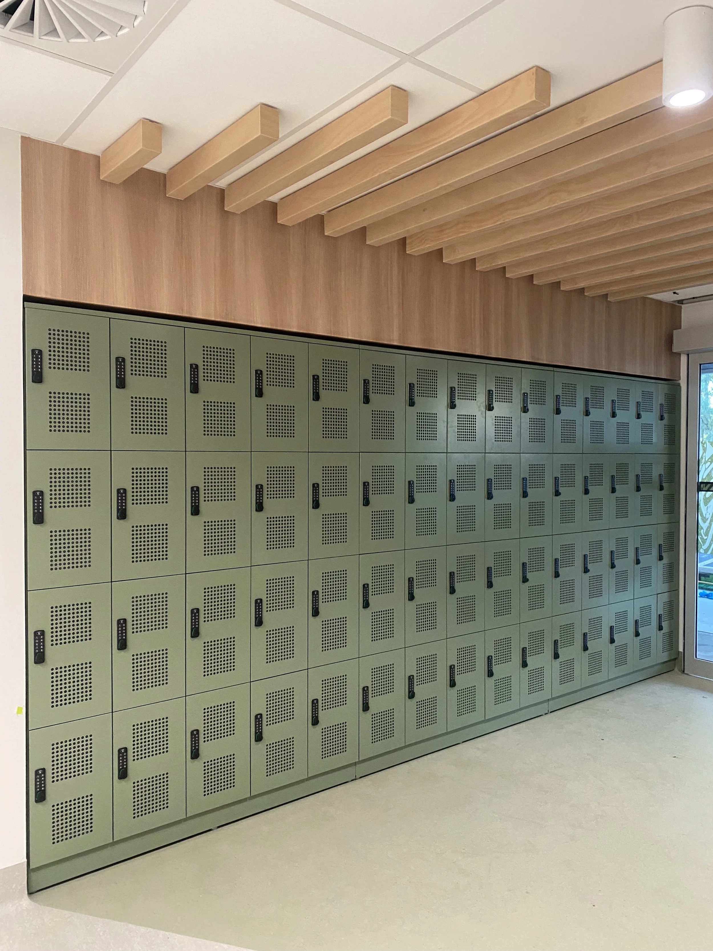 Concealed metal lockers bespoke joinery