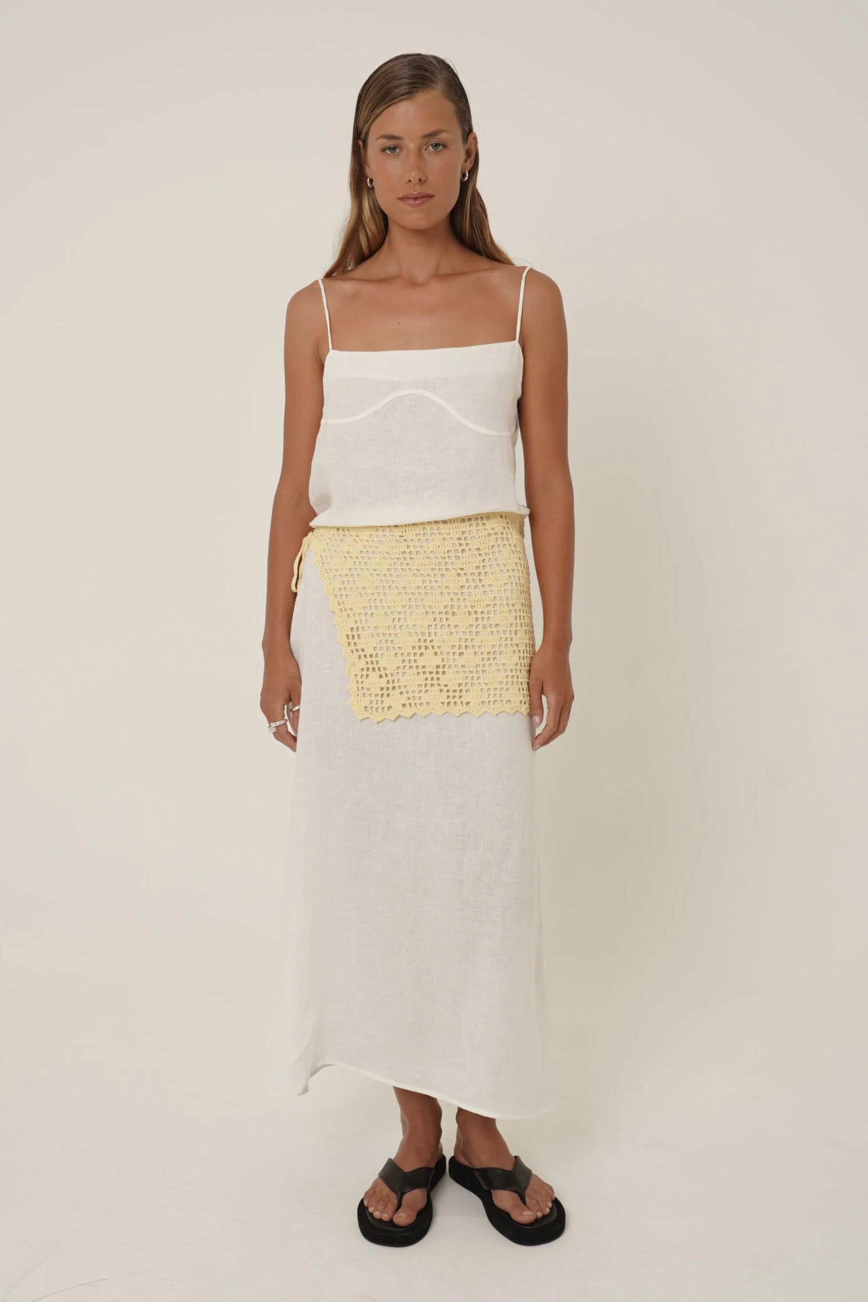 Woman wearing Prélude Maxi Dress in pure linen and Labelle Crochet Sarong