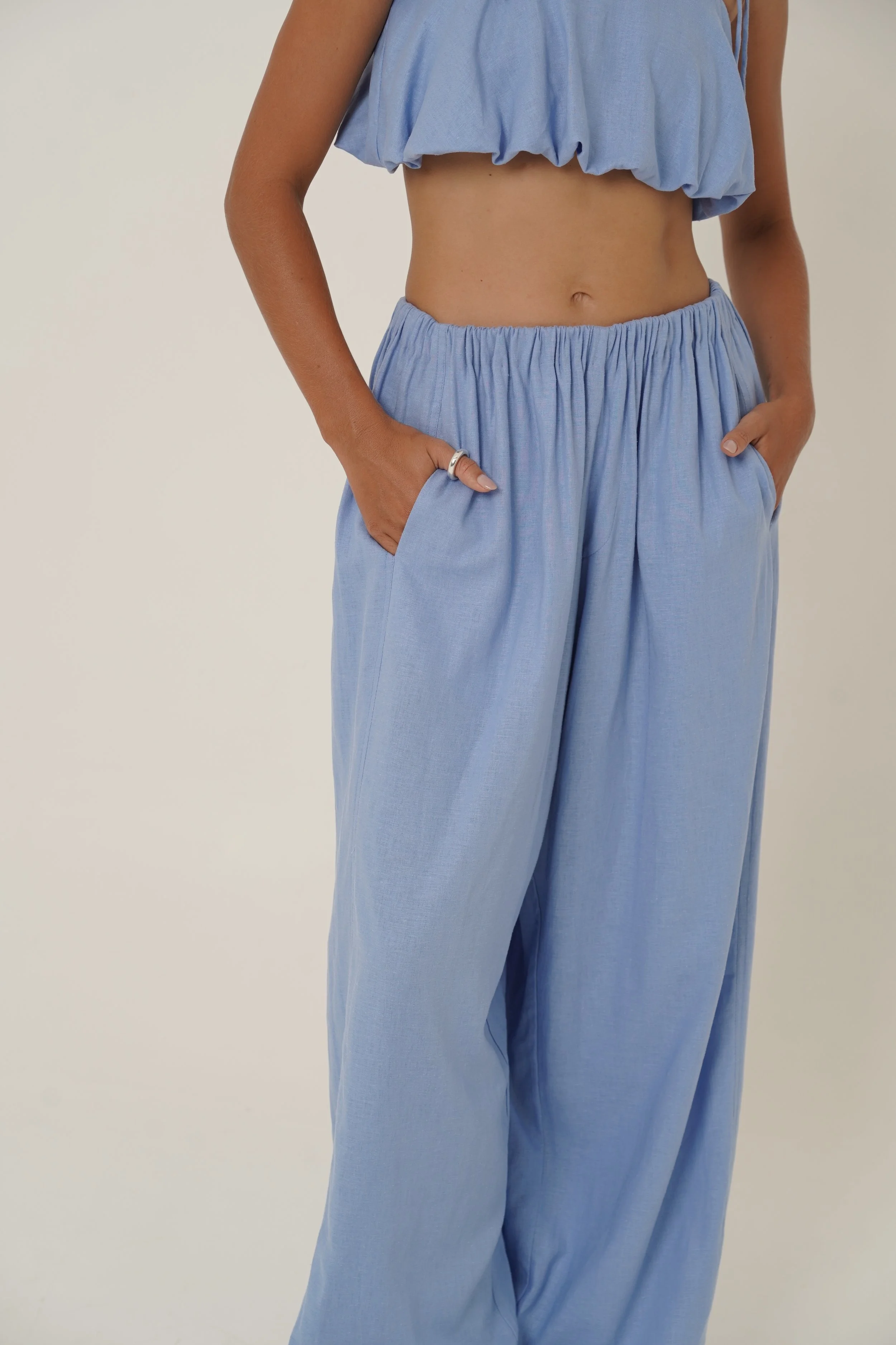Woman wearing linen Crescendo Pants and Top with elastic waist and french seam - close-up