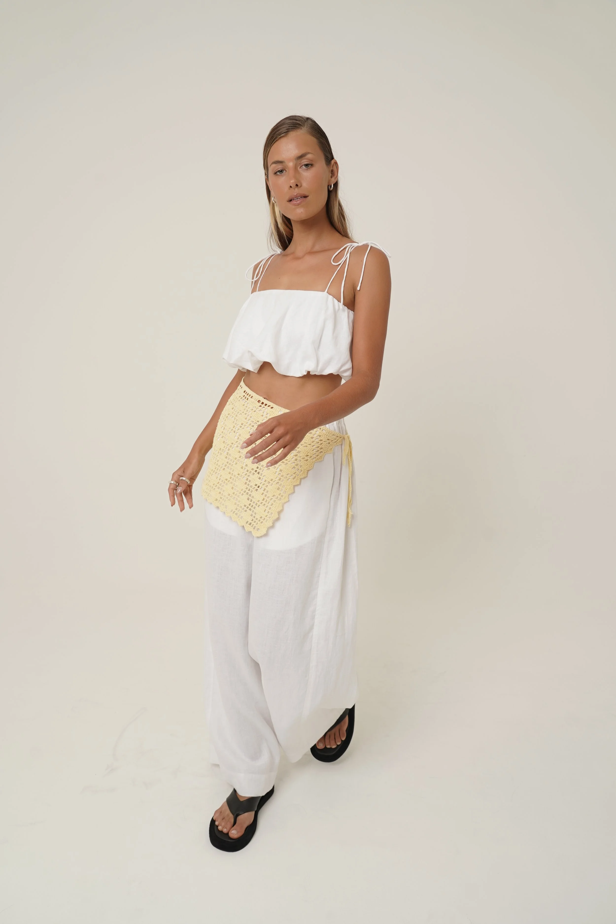 Woman wearing linen Crescendo Top with shoulder straps and Labelle Sarong made from Cotton Crochet