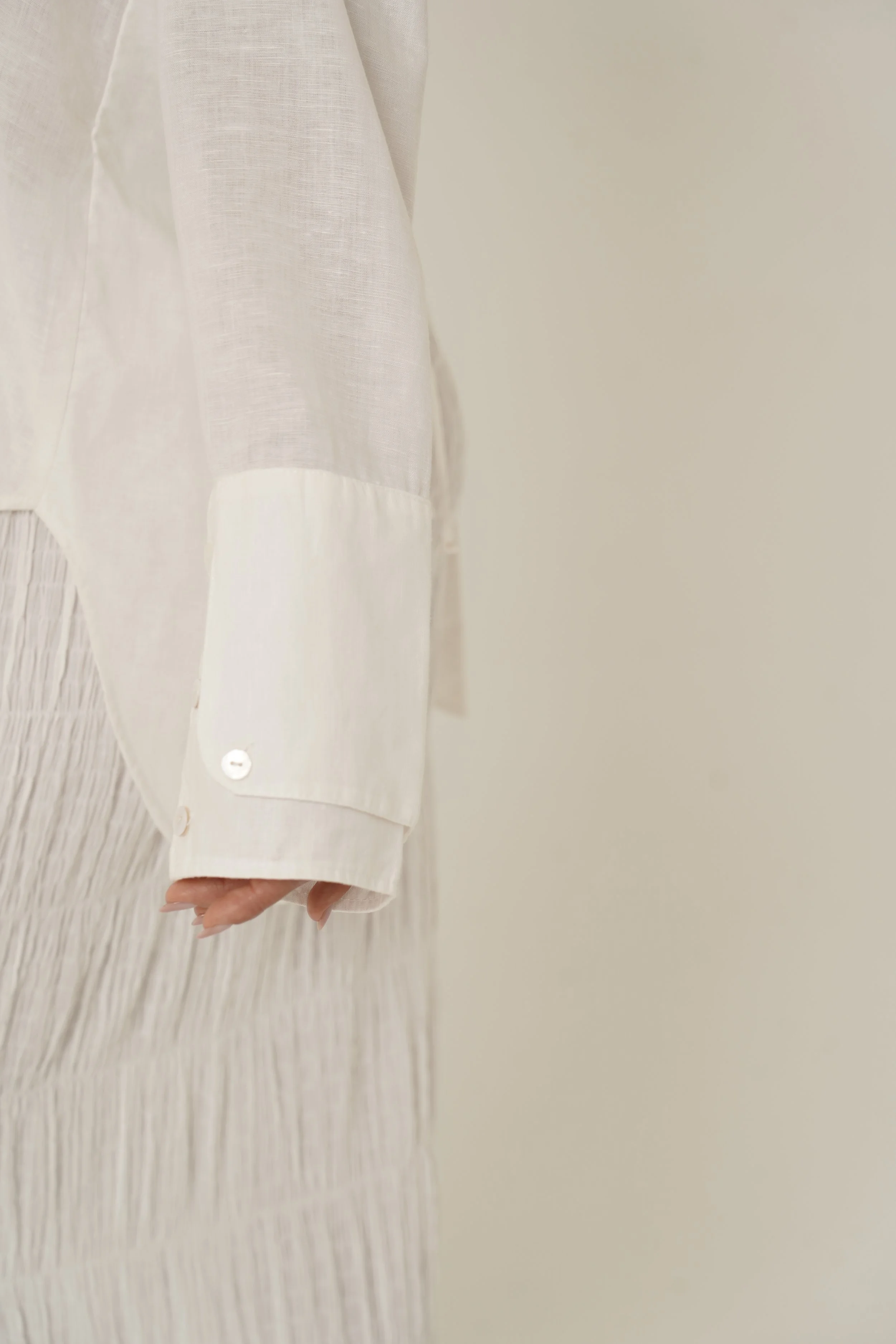 Cuff detail of Reformation Shirt in white linen from Sutura Studio