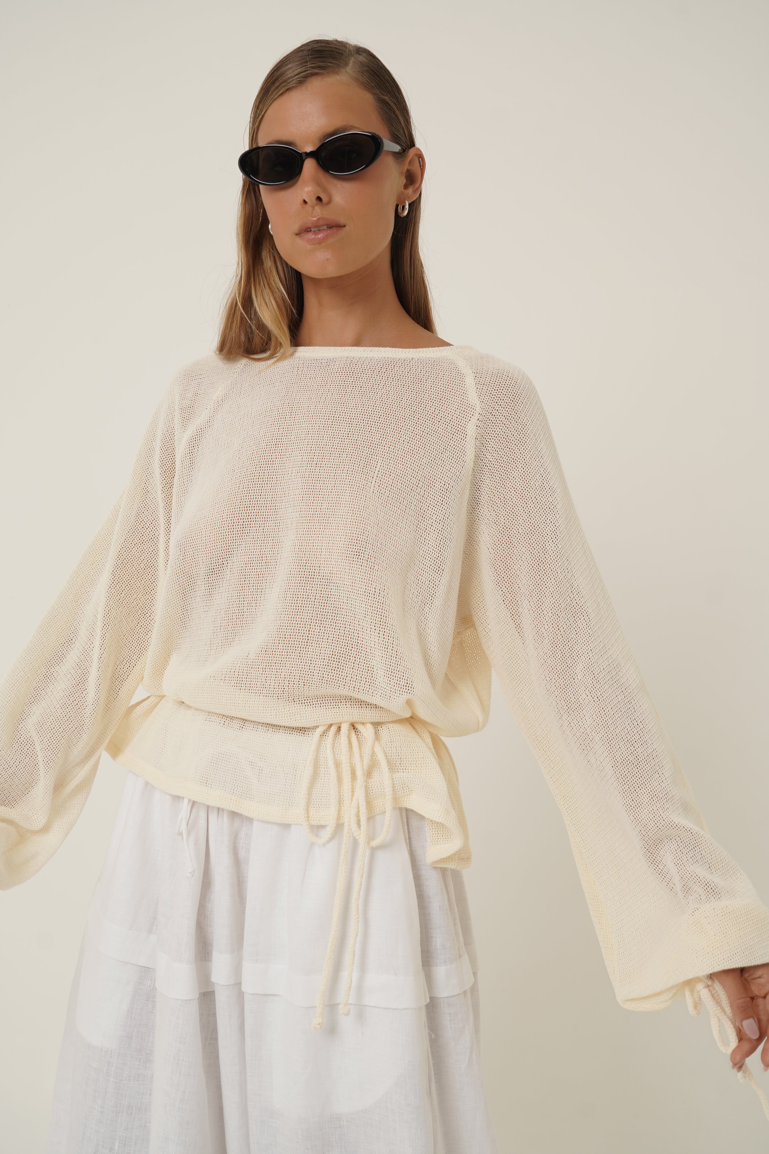 Front view of woman wearing Kaos Shirt and Sunglasses