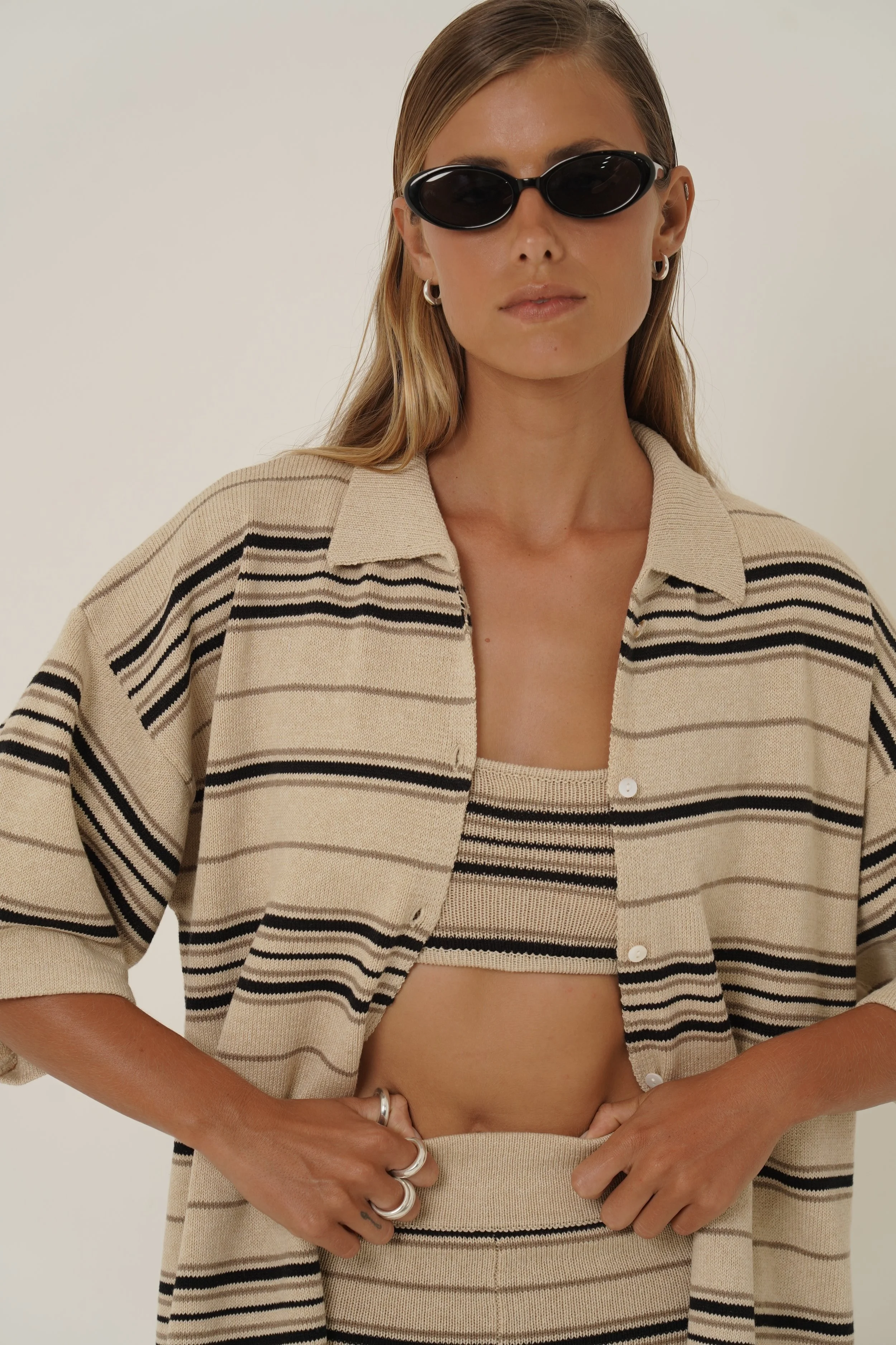Woman wearing Dune Shirt and Top with striped pattern in cotton knit an sunglasses