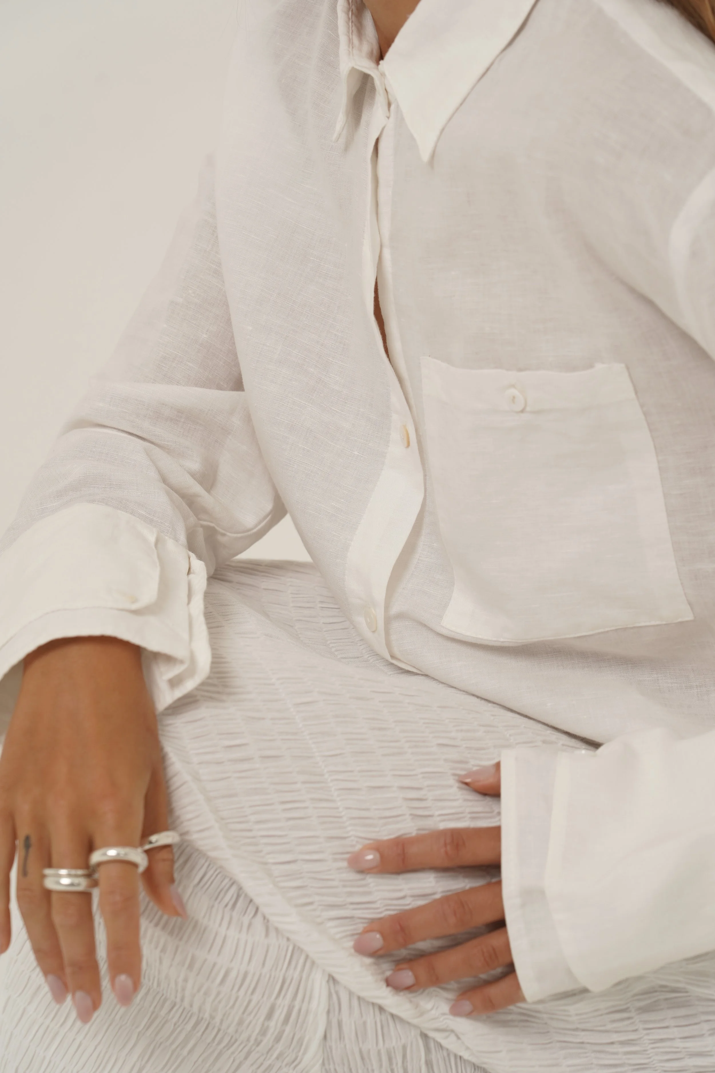 Detail view of Reformation Shirt white linen