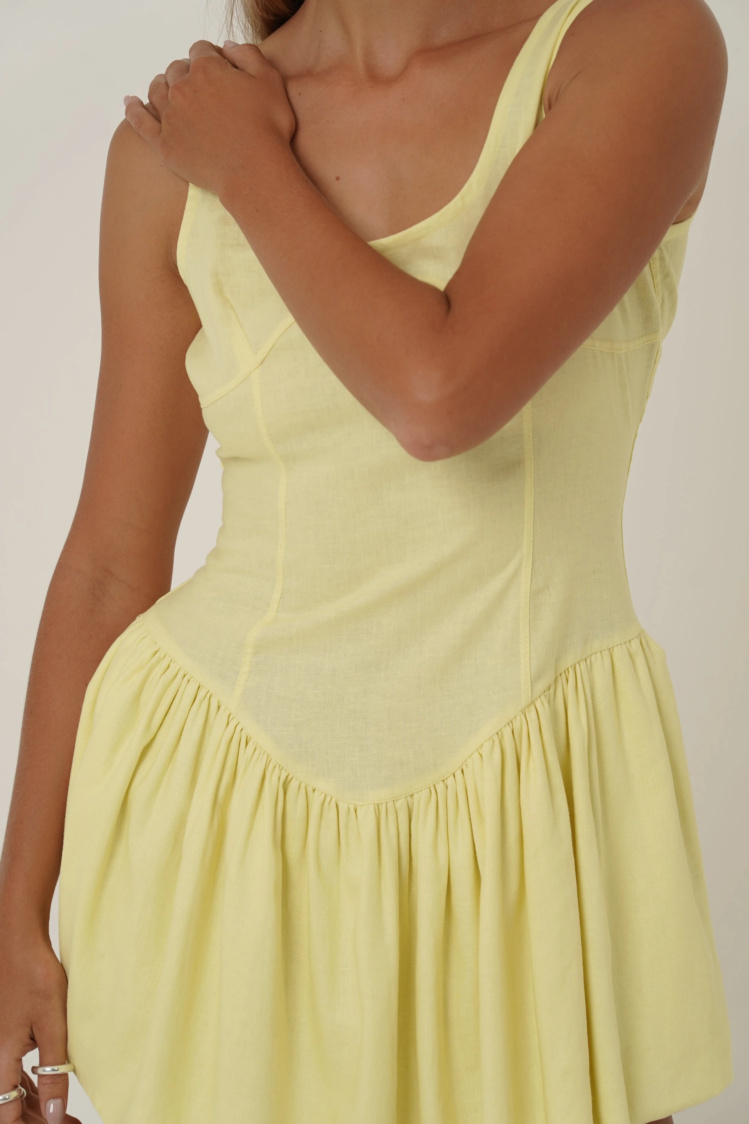 woman wearing prelude yellow mini dress from Sutura Studio