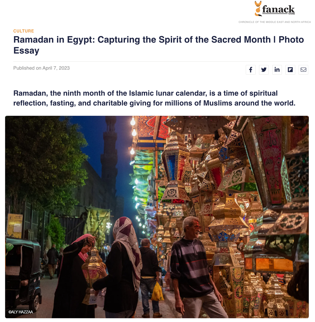 Street market in Egypt during Ramadan evening with colorful lanterns and people shopping.