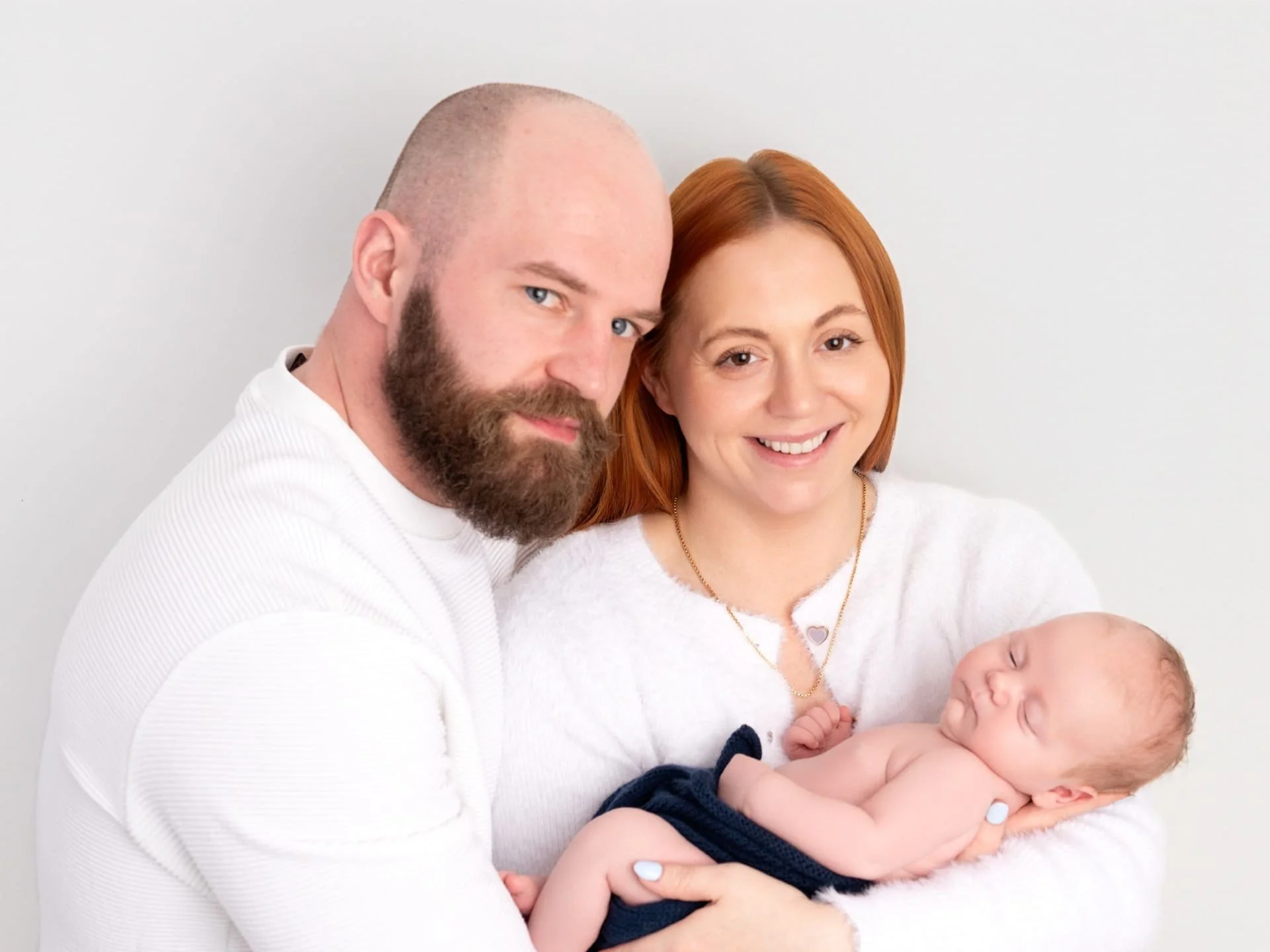 A man, woman and their new-born baby 