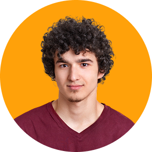 Portrait of a young man with curly dark hair wearing a maroon shirt against an orange background.