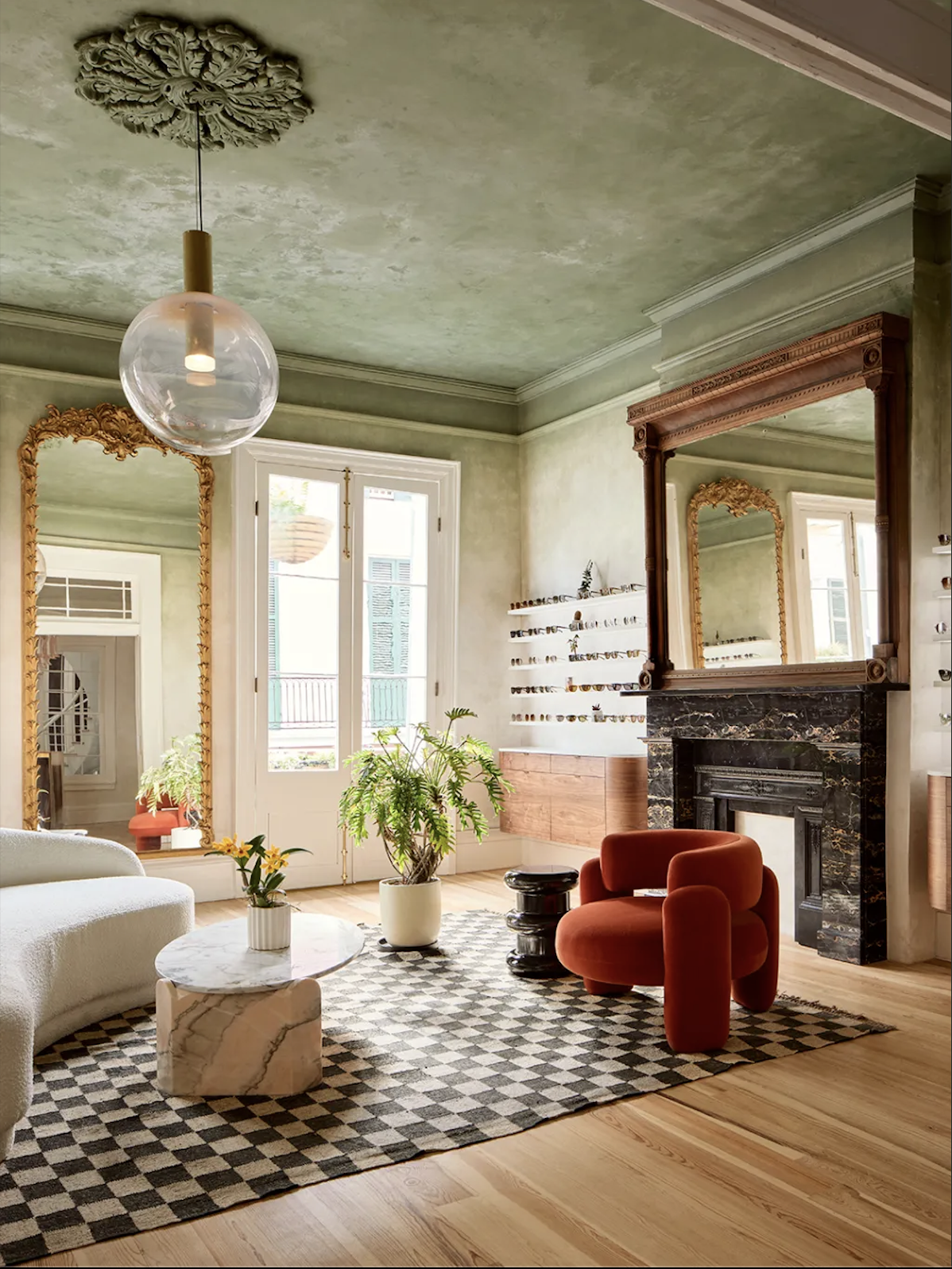Period living room with ornate ceiling rose, marble fireplace and gilt mirror in a Kennington home