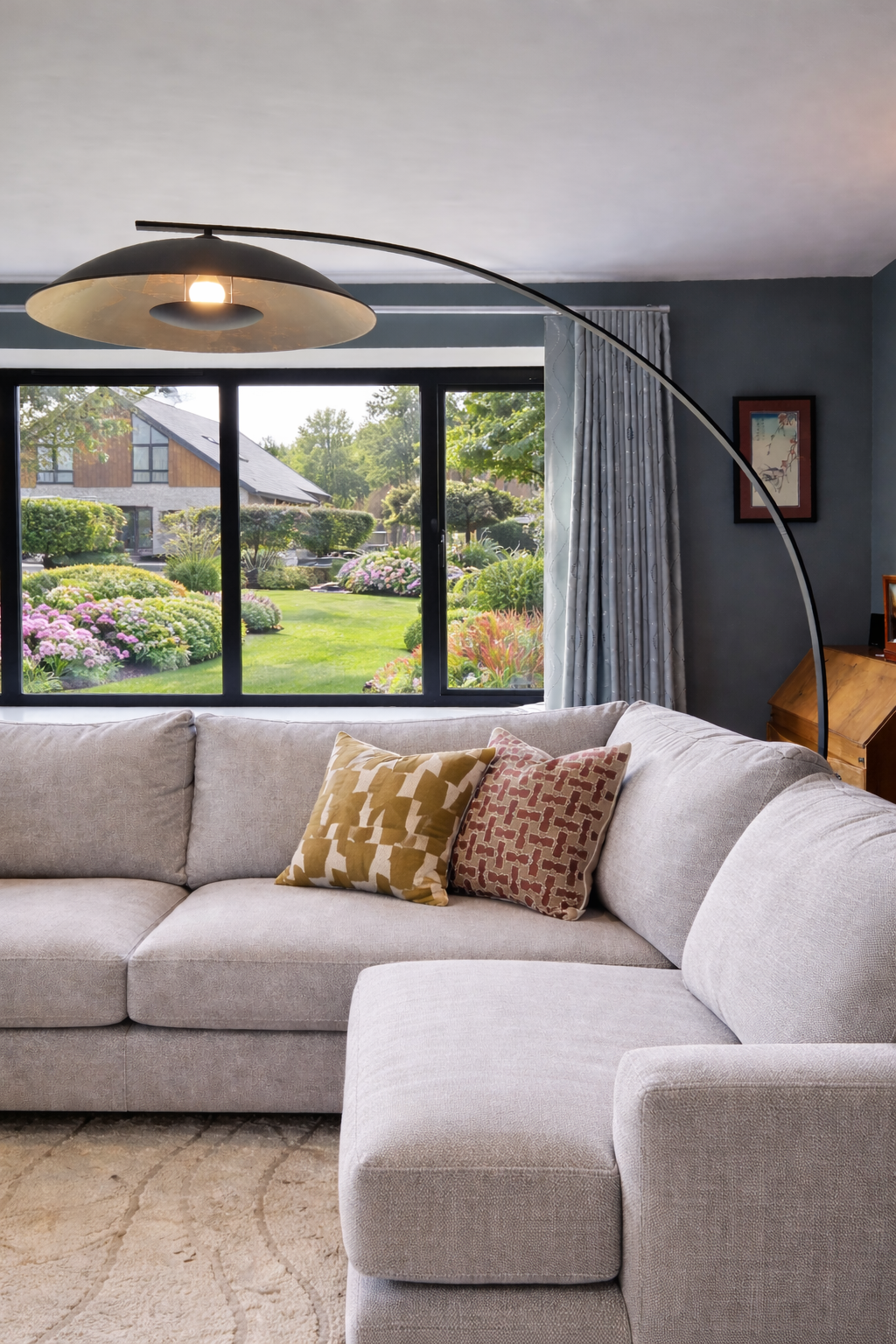 Interior designer, light grey sofa, arc lamp, john lewis cushions