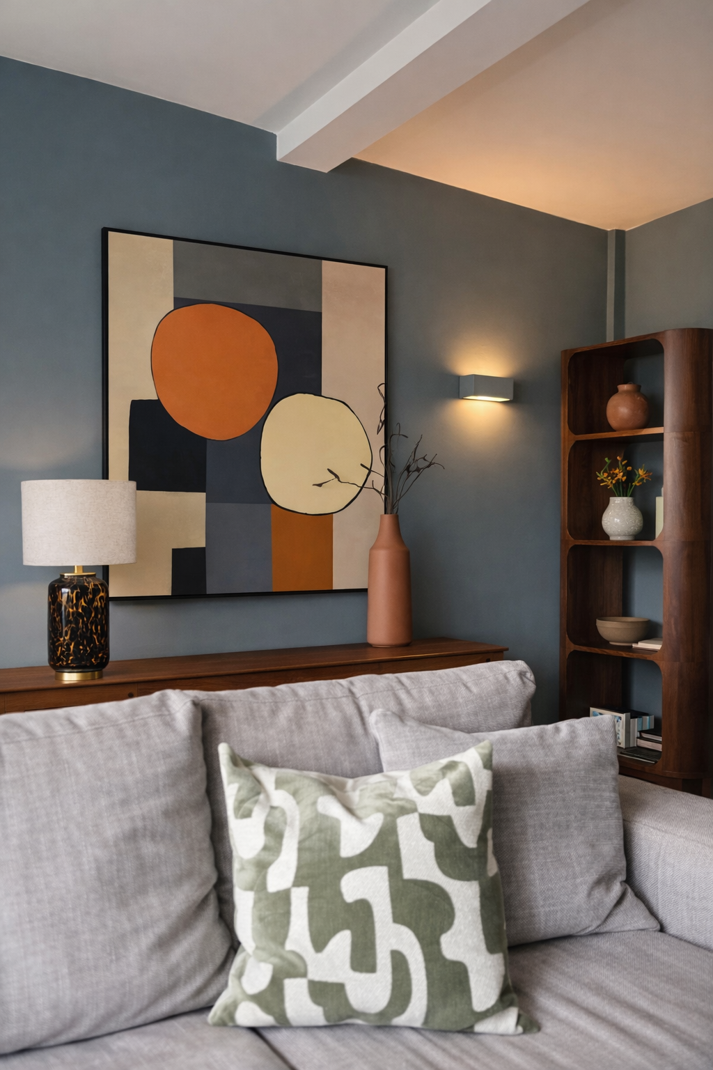 John lewis cushions, abstract art work, grey blue walls, glass lamp
