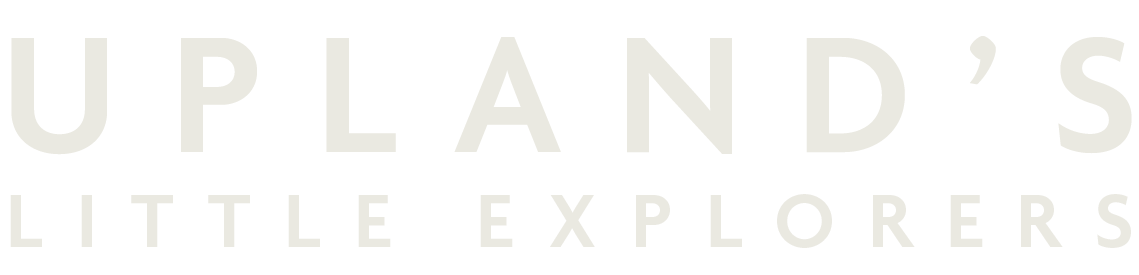 Text reading 'Upland's Little Explorers' in a large font on a black background.