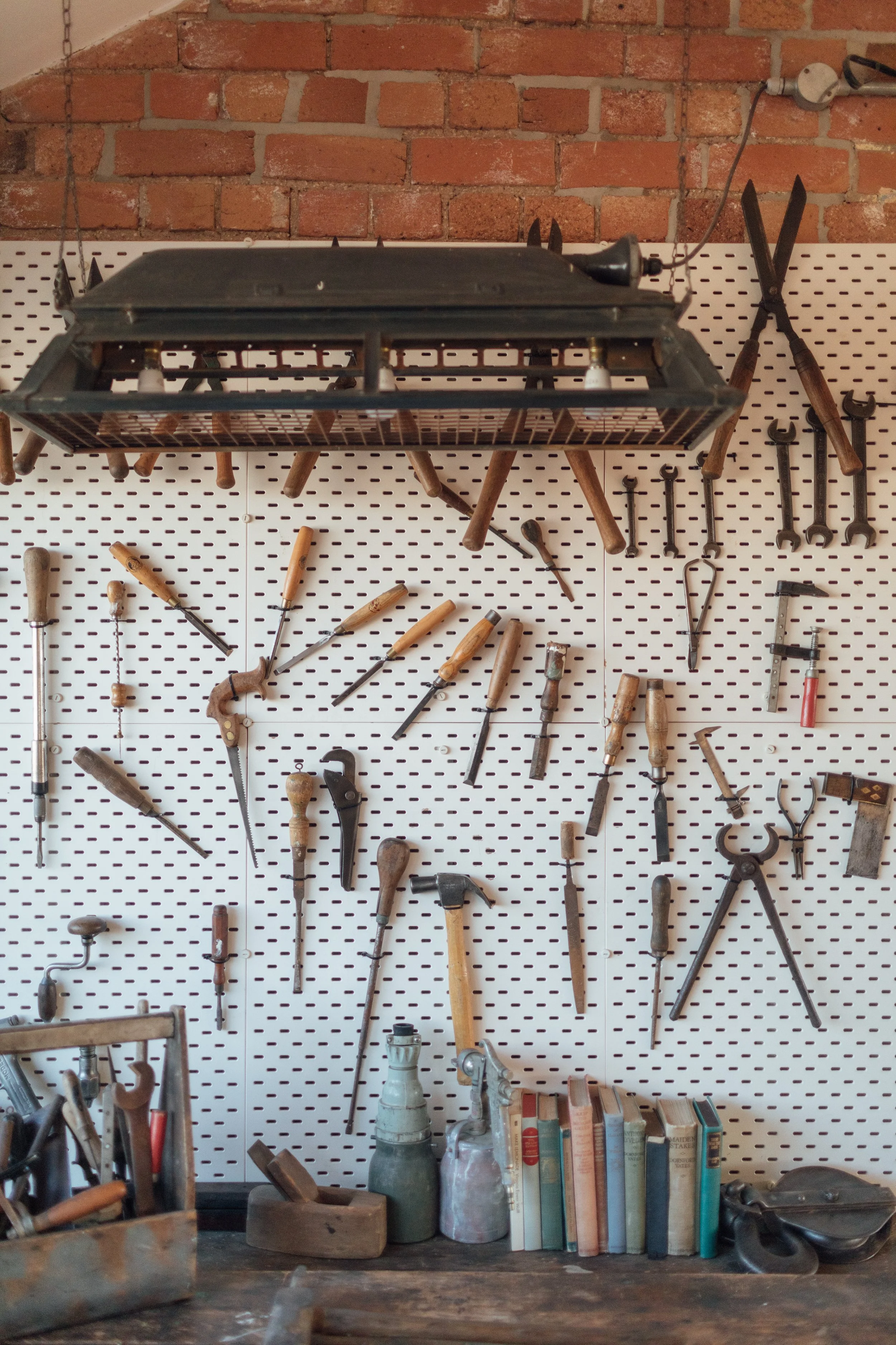 The workspace, decorated with vintage tools