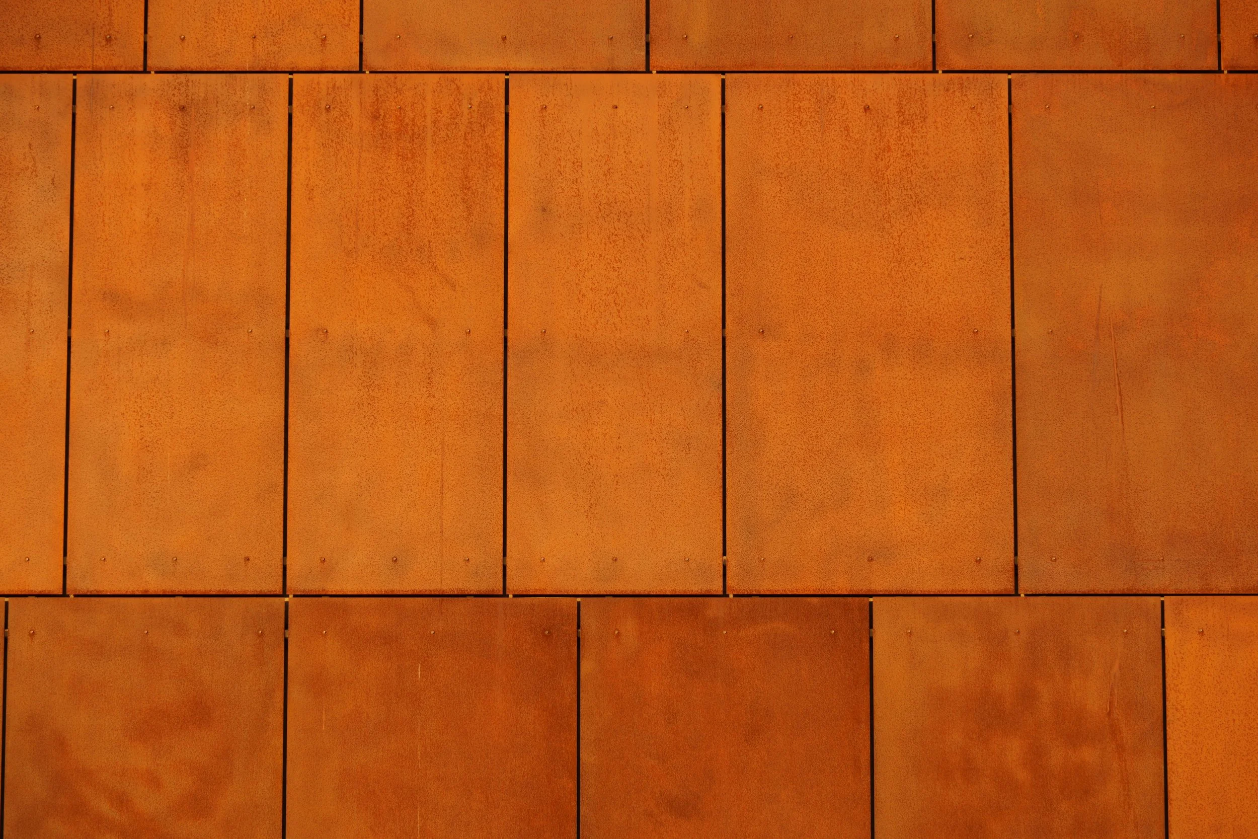 Modern Corten steel siding detail showing design and constructability expertise.