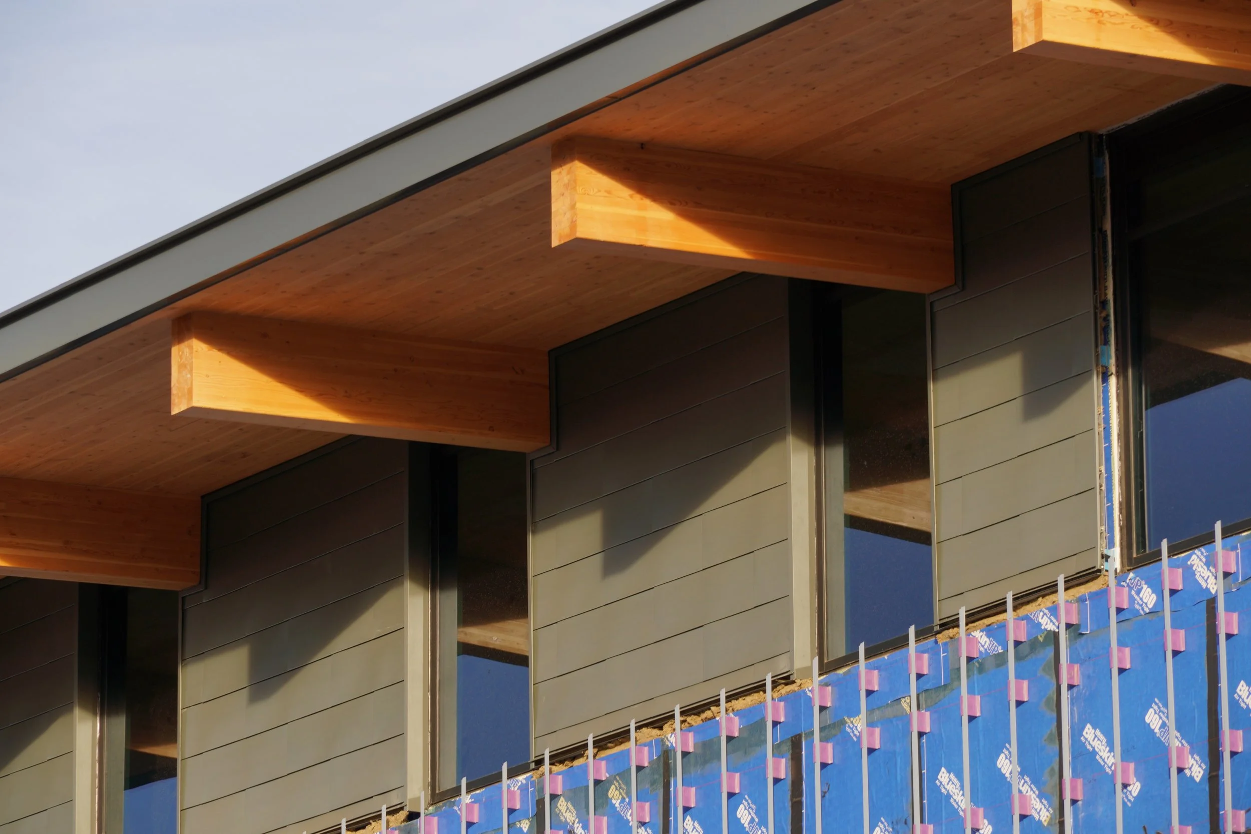 Mass timber construction and envelope detailing at Gianforte Hall showing complex capital project delivery.