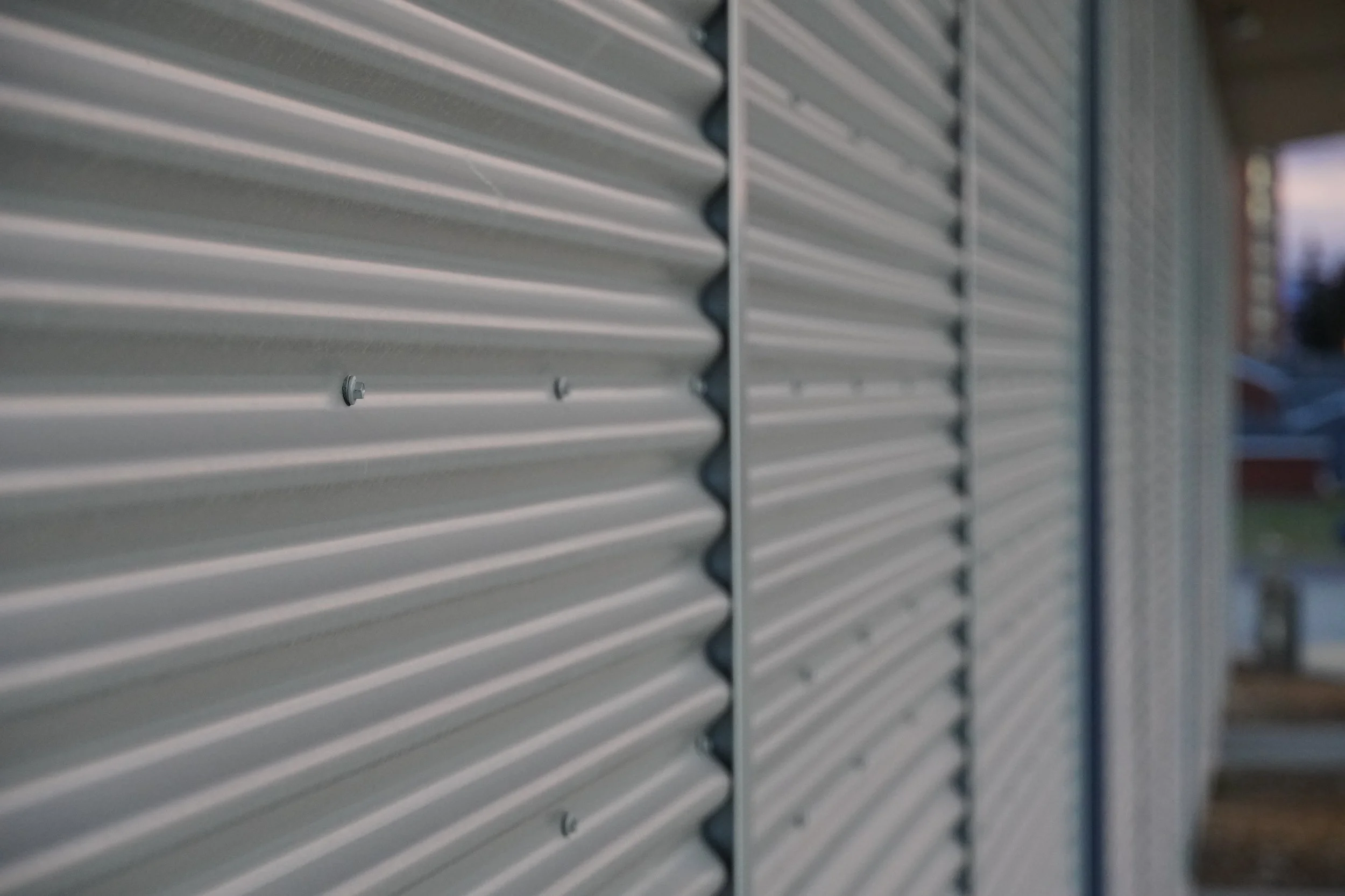 Corrugated metal siding at a recreation and athletic facility showing durability and elevated design detailing.
