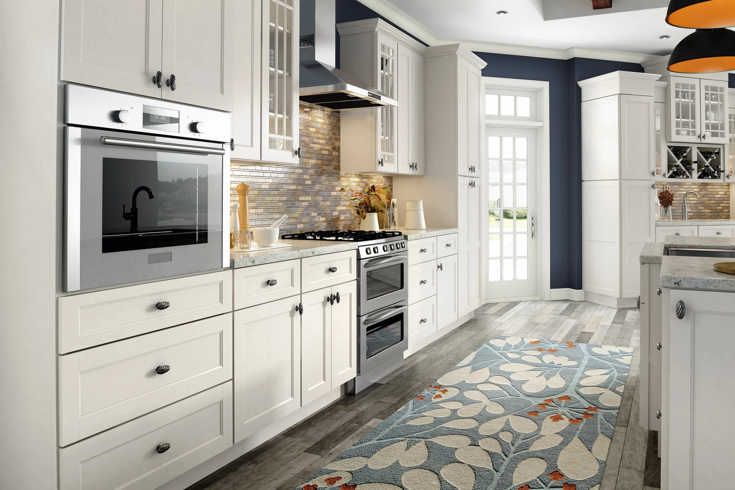 Bright kitchen with white cabinets, stainless steel oven, gas stove, mosaic tile backsplash, and a colorful floral rug on wood flooring.