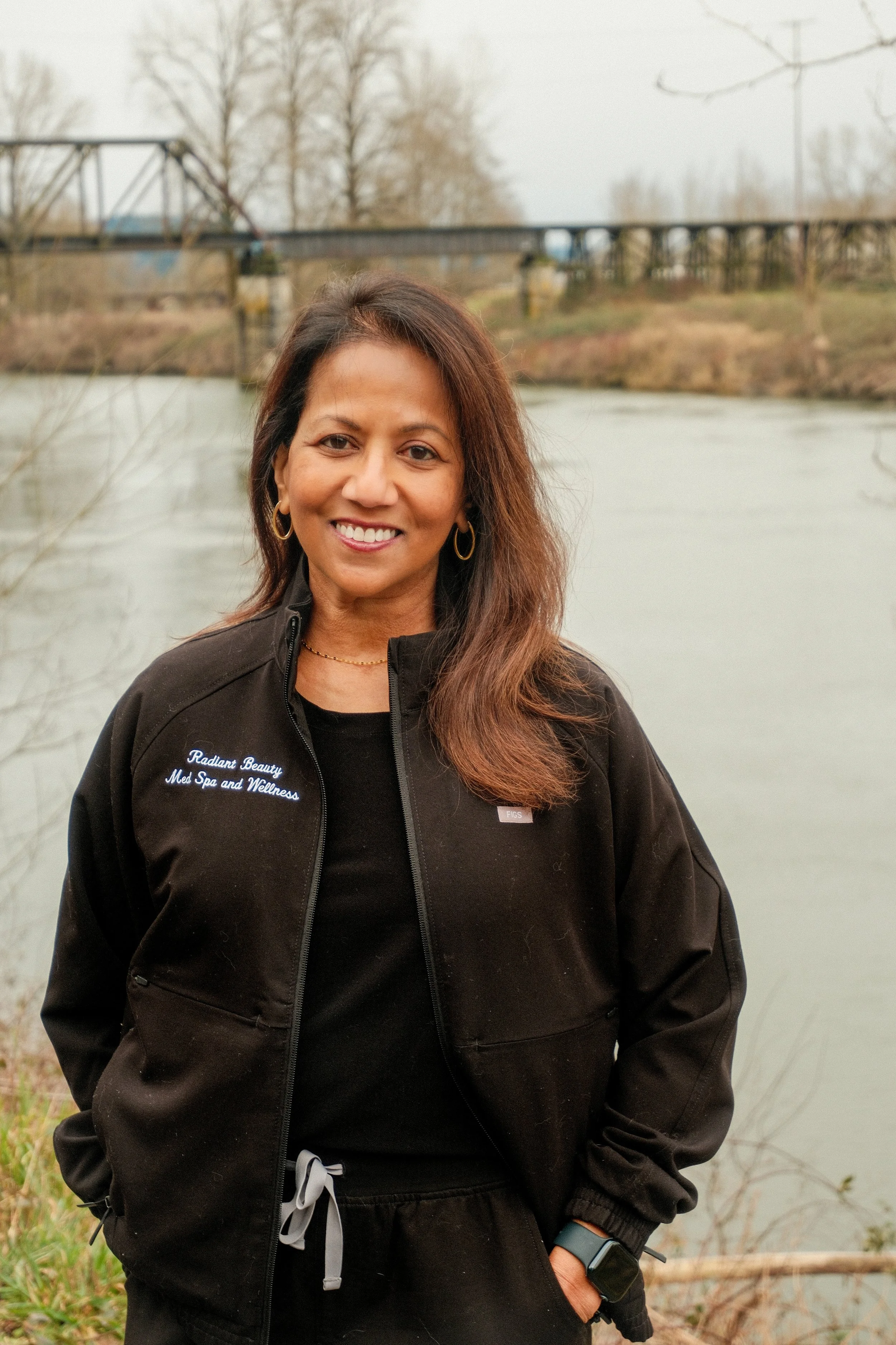 Kanchana Allan, BSN, MSN, ARNP, medical director standing in front of the Snohomish river
