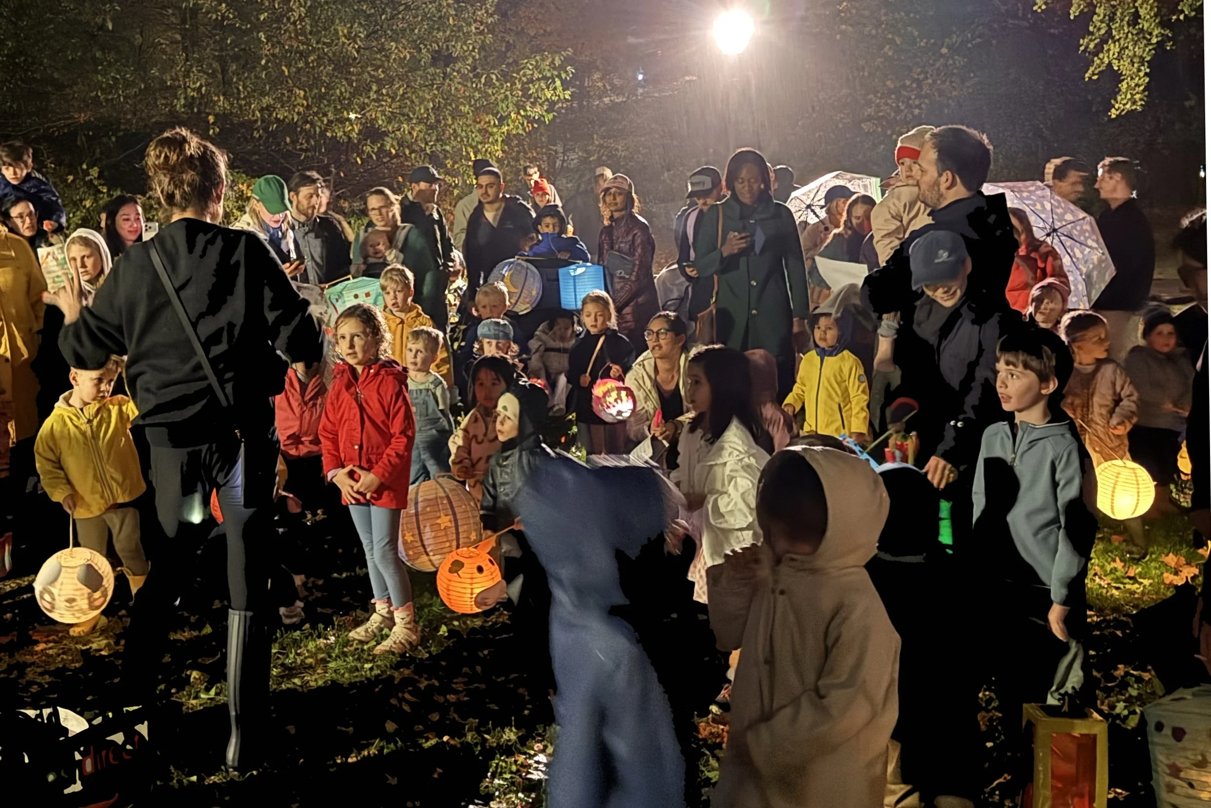 Barbara Rellstab telling the Sankt Martin story to children during Rella’s Spielhaus’s annual Laternenlauf in Central Park.