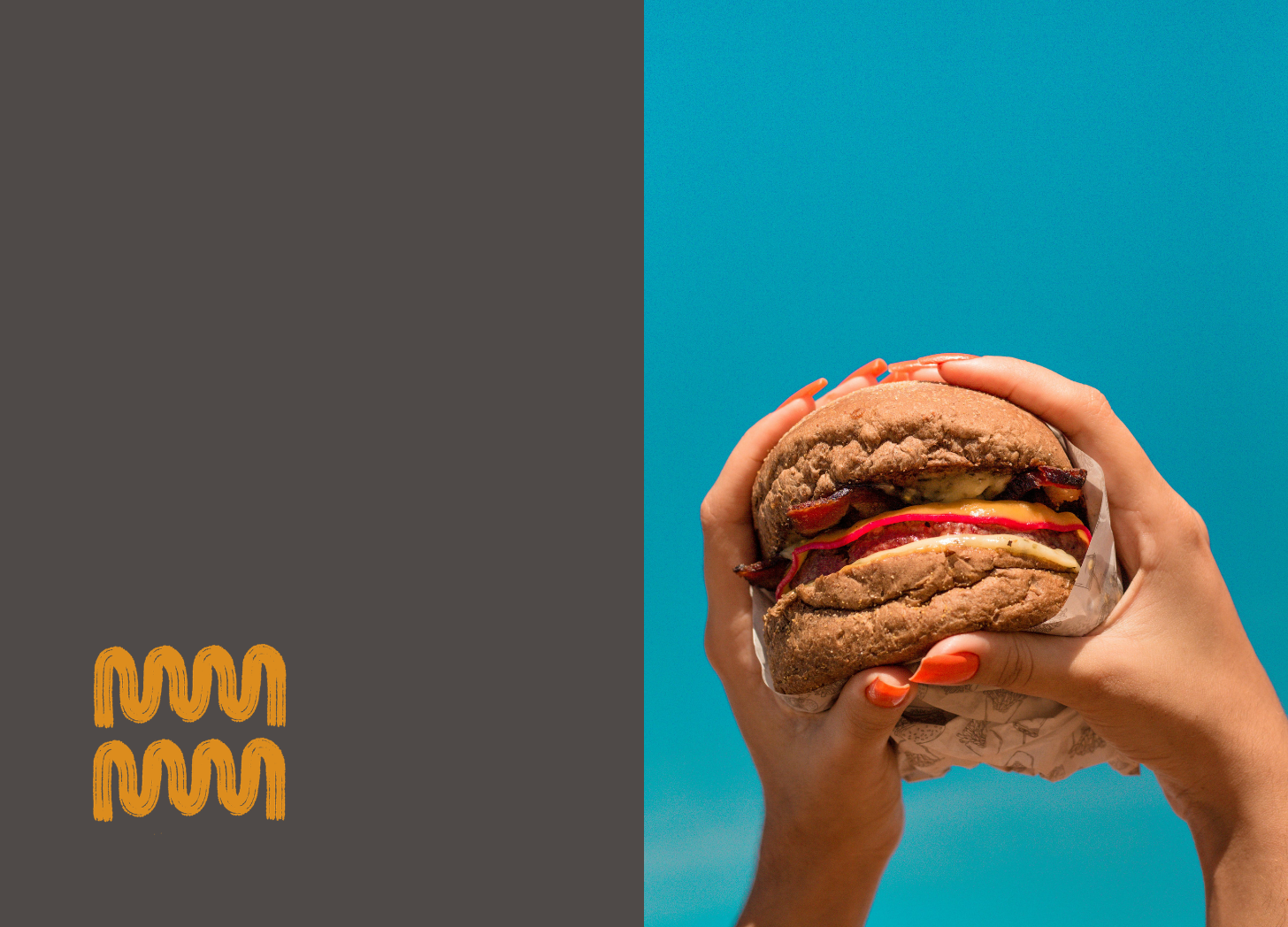 An image of hands holding a burger