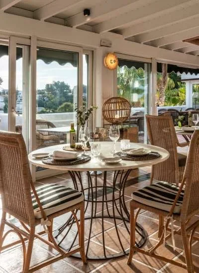 A table set for two in the dining room at Madre restaurant in Jávea