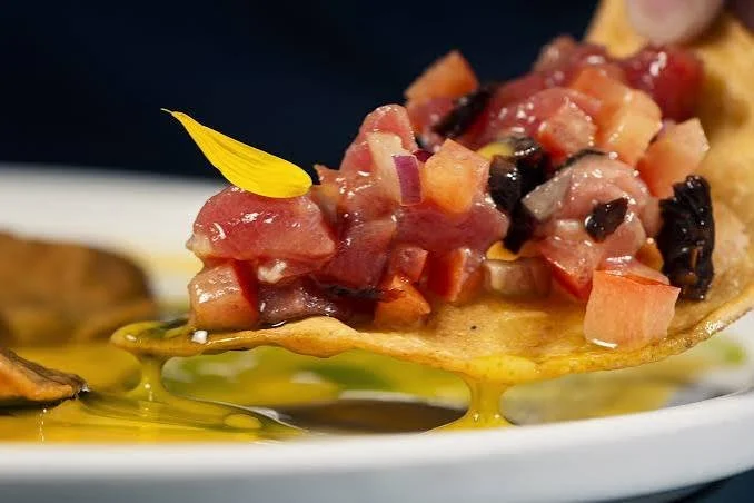 Cubed fish served on flatbread Enolo restaurant at Dionis Hotel Boutique
