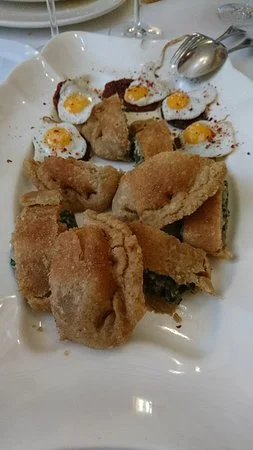 Breaded meat and eggs served at Ca L'Angels restaurant in Polop