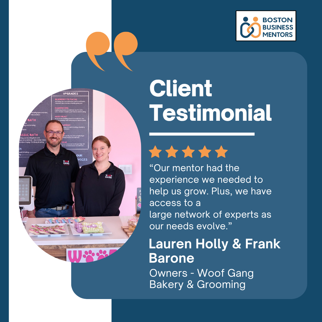 Client testimonial for Boston Business Mentors featuring Lauren Holly and Frank Barone of Woof Gang Bakery & Grooming, with a photo of them standing behind a counter, smiling, in their business. The testimonial praises the mentors' experience and support, accompanied by a five-star rating.