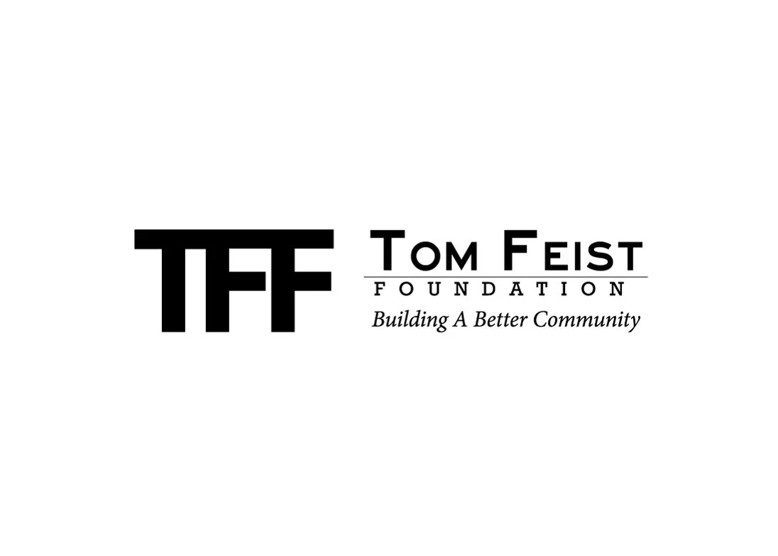 Logo of the Tom Fiest Foundation with the slogan 'Building A Better Community'