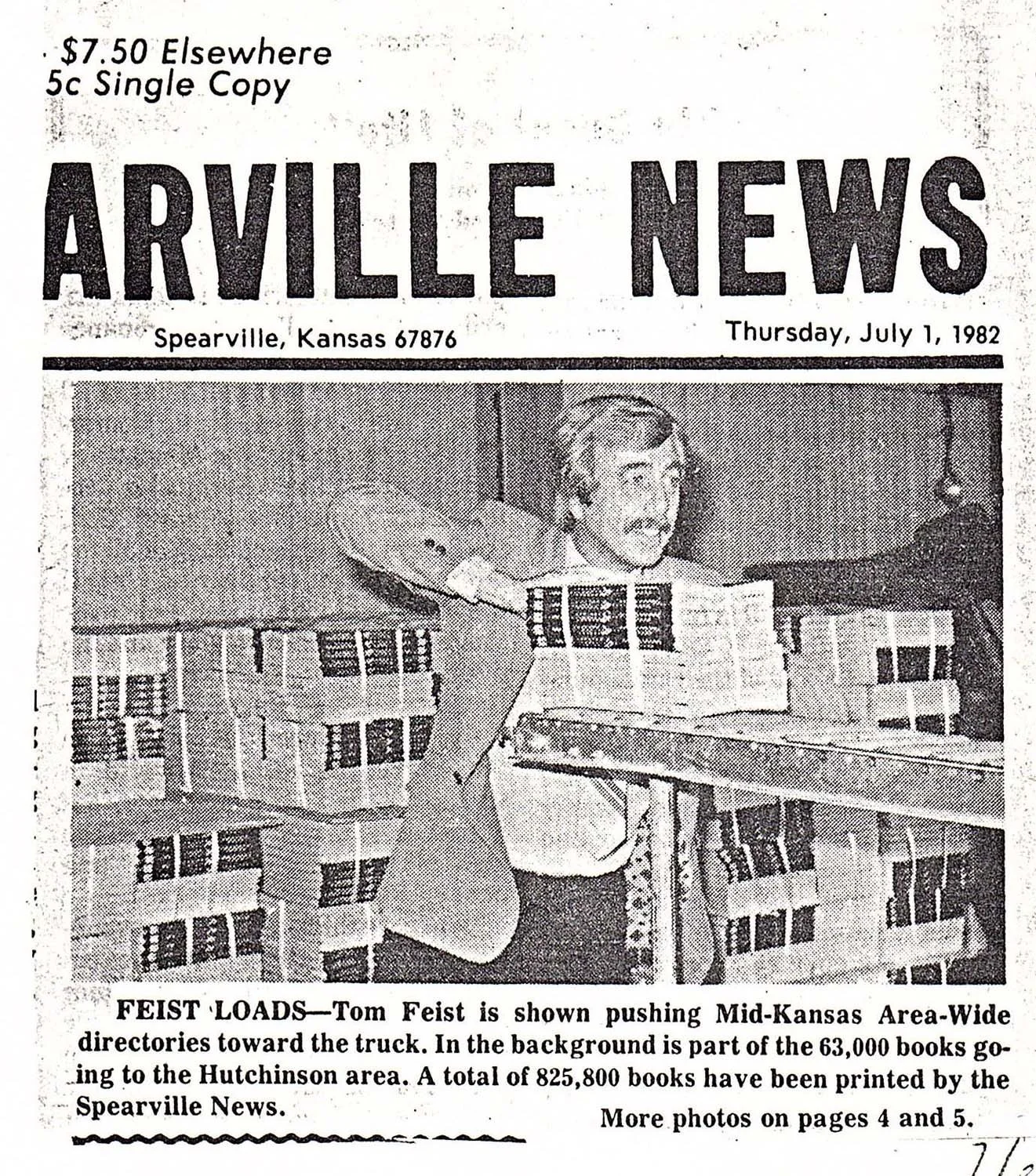 A black-and-white newspaper front page titled "Arvile News" dated July 1, 1982, showing a man pushing a truck loaded with books. The background includes part of a large building, and the caption mentions Tom Feist and the distribution of books.