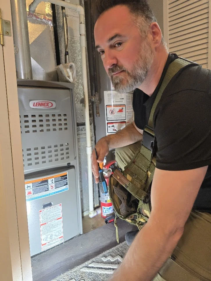 Foundation First Home Inspections professional inspecting the residential furnace and HVAC unit in the Northwest Chicago suburbs.