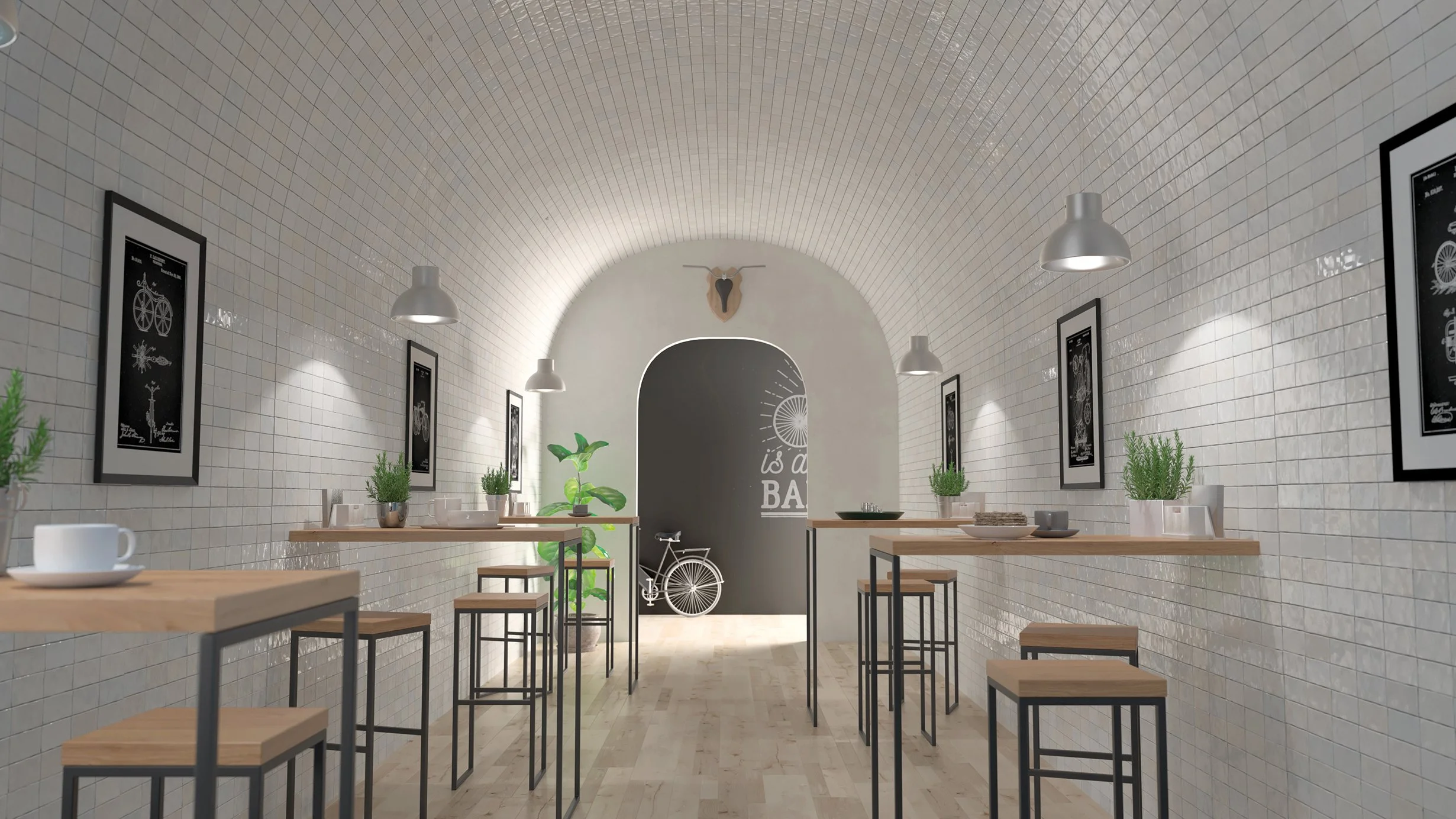 Interior de un café con paredes de azulejos blancos, mesas altas de madera con snacks y tazas, adornado con plantas verdes, cuadros enmarcados con ilustraciones en blanco y negro, y luz tenue, en el fondo un arco con una puerta y un decorativo de un 