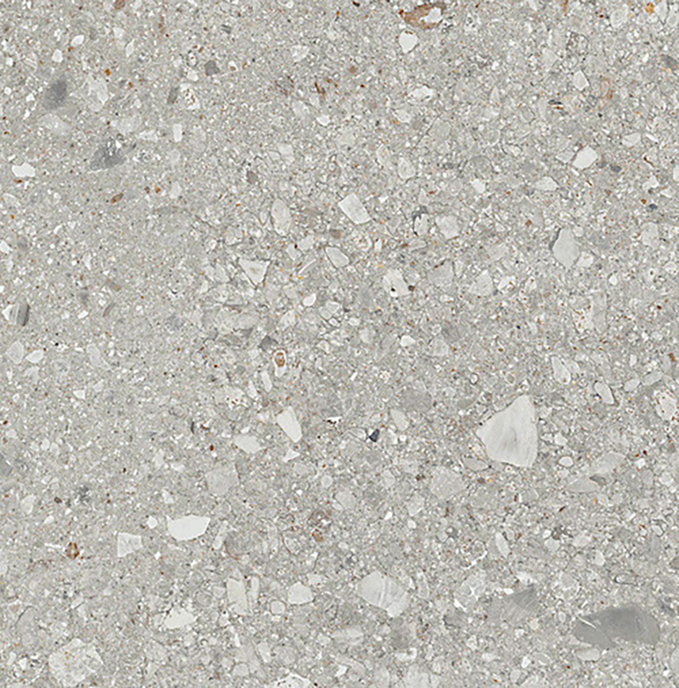 Superficie de concreto con pequeñas piedras y grava.