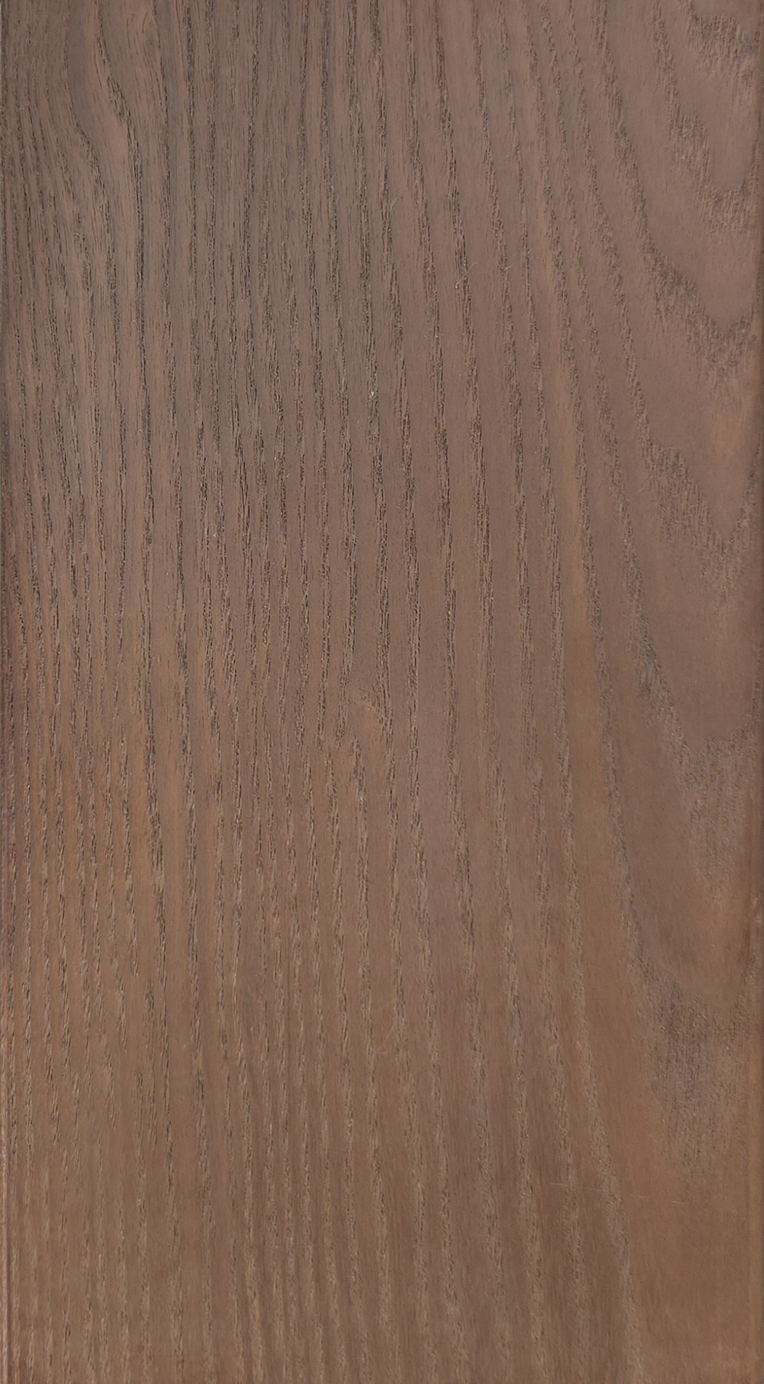 Superficie de madera con vetas en tonos marrones.