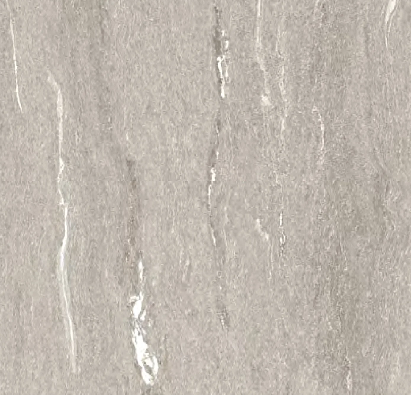 Superficie de una pared de color gris claro con marcas blancas.