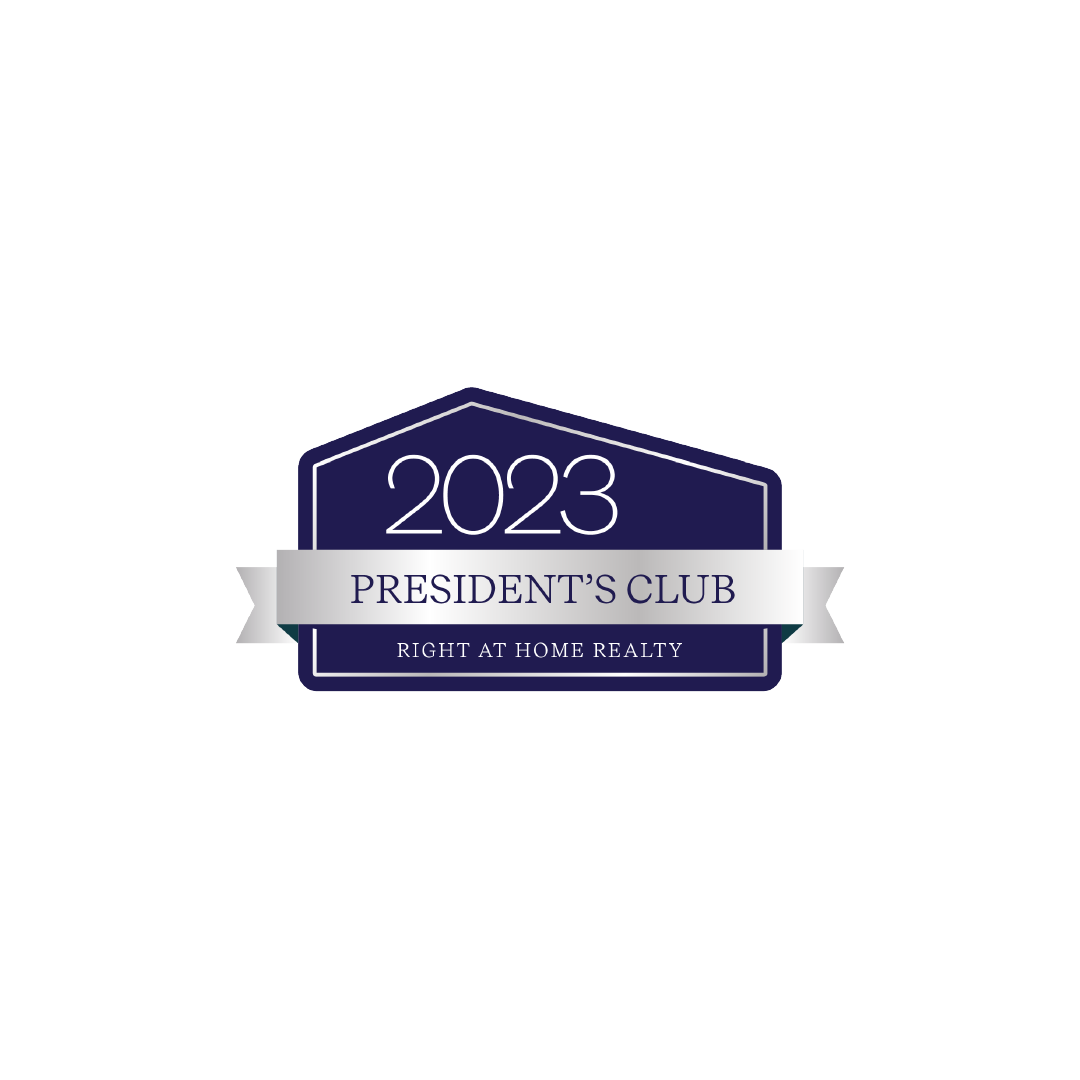 2023 President's Club badge logo for Right at Home Realty with navy blue and silver design.