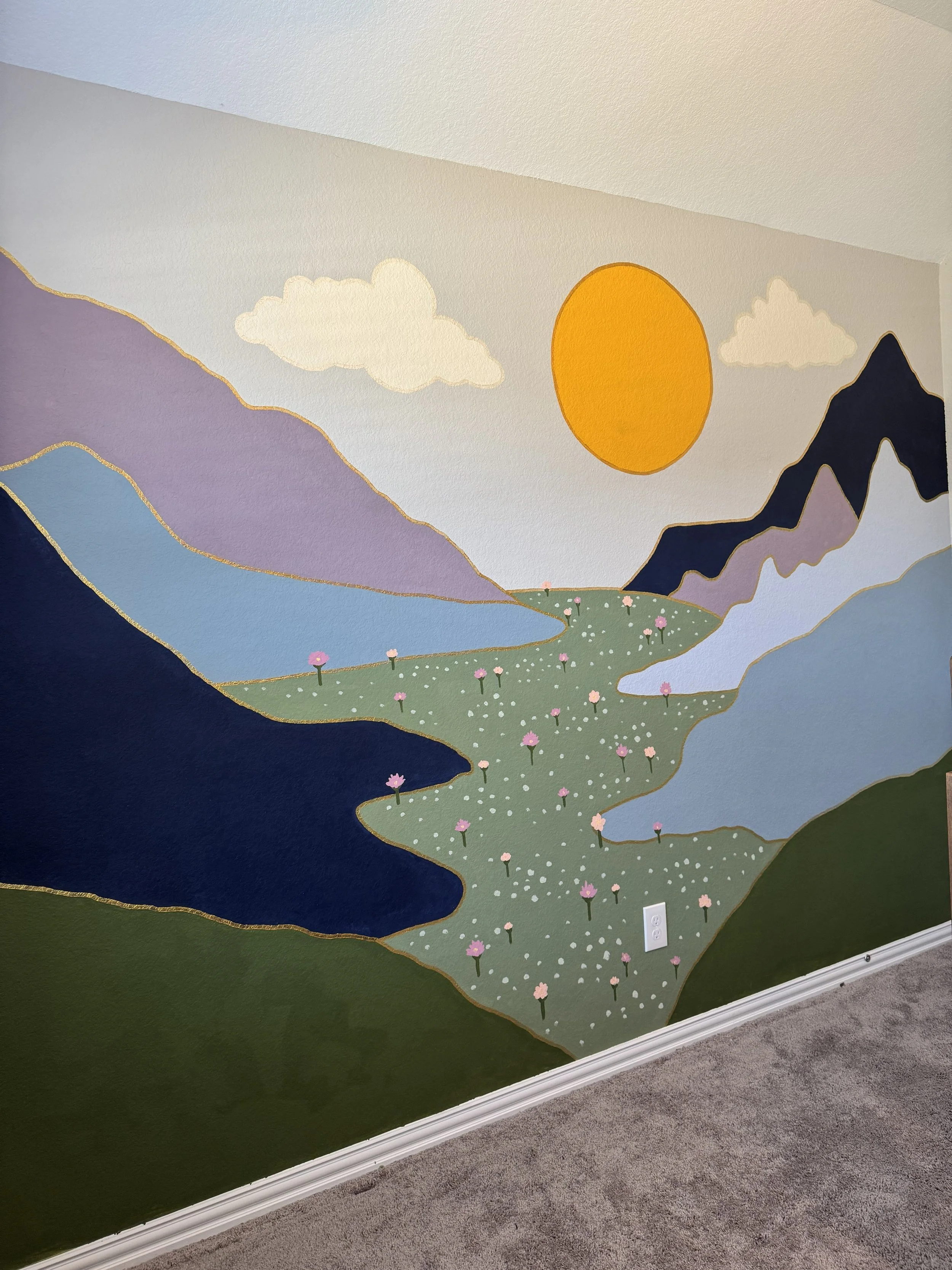 A colorful mural of a nature scene with purple mountains, a bright yellow sun, white clouds, a green valley with pink flowers, and a blue river.