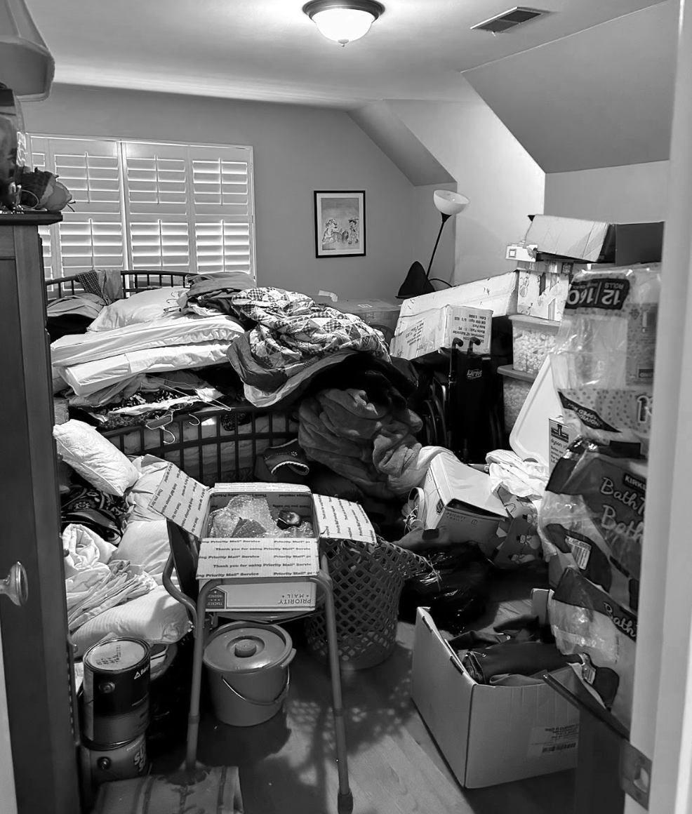 Before shot of a cluttered bedroom in need of professional organization