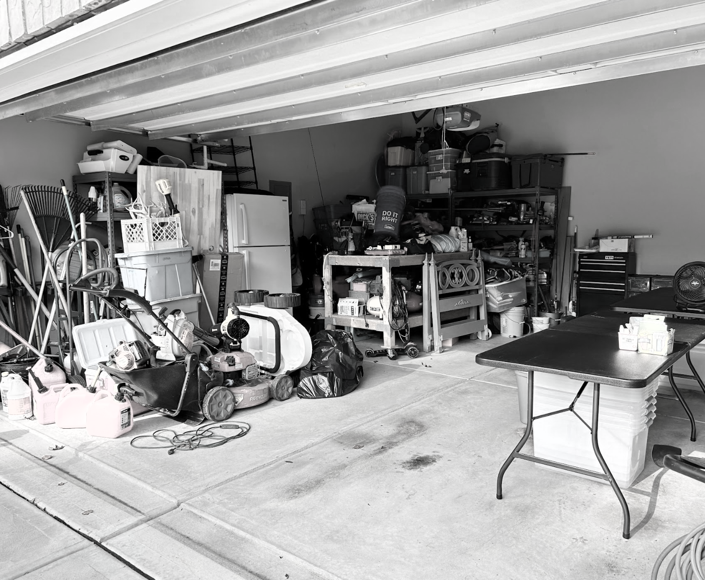 Before shot of a cluttered garage in need of professional organization in Davie County NC