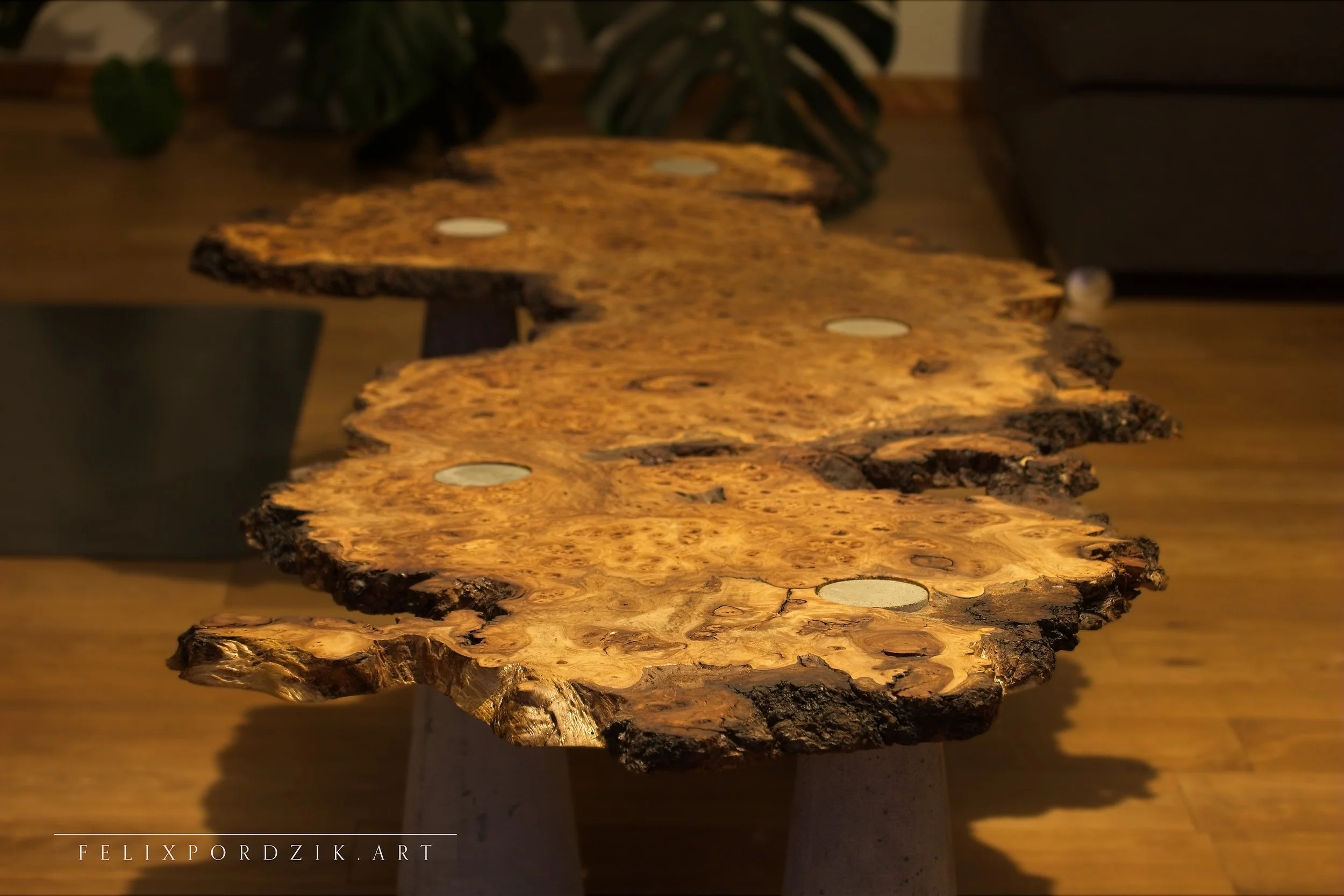 Japanese-inspired tea table from— handcrafted burl wood with concrete accents, combining craftsmanship and sculptural minimalism.