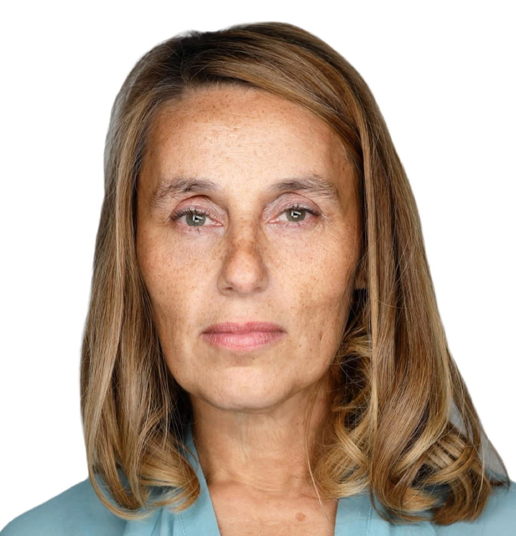 Close-up portrait of a woman with light brown hair and green eyes, wearing a light blue top, with a serious expression.