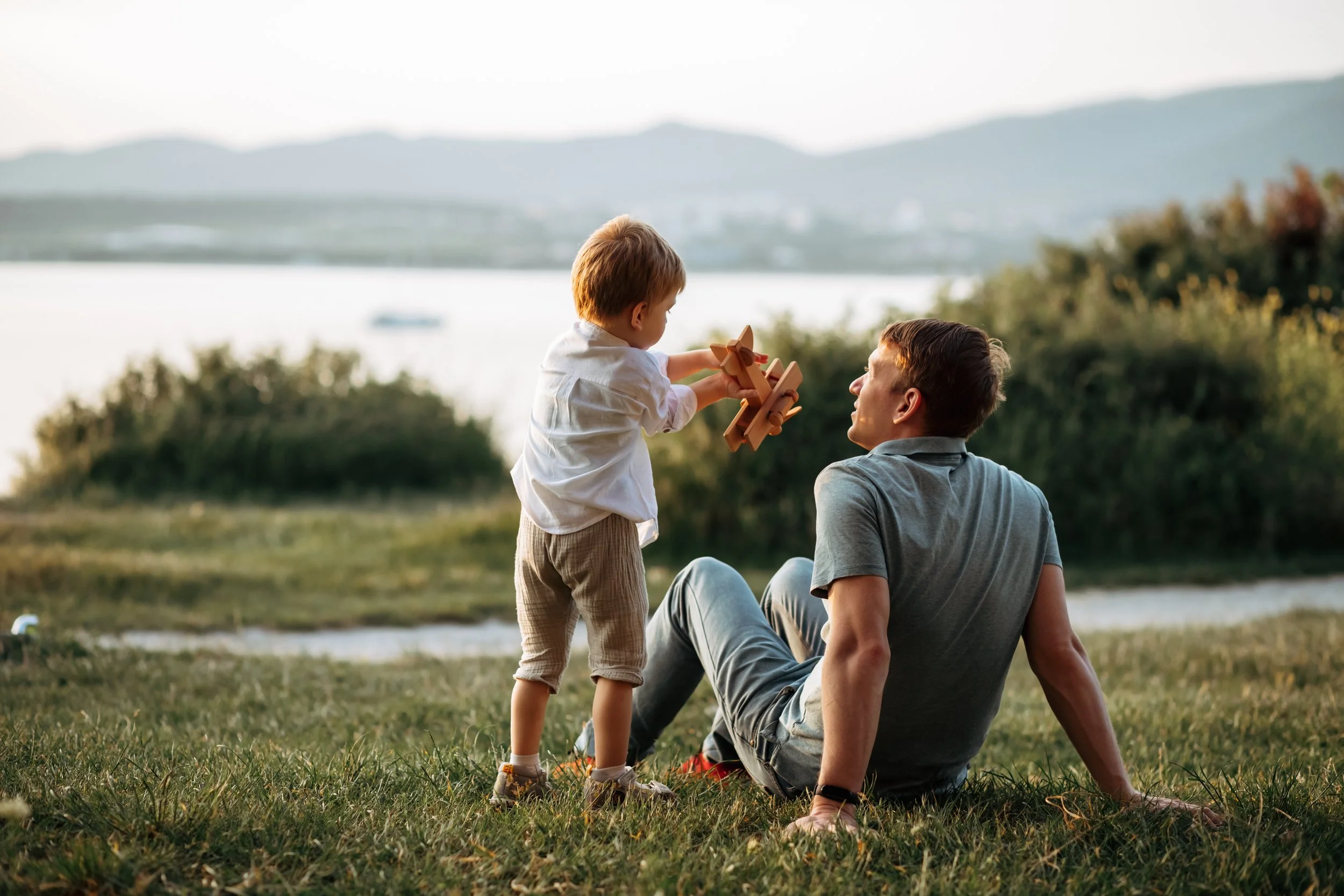 Image of father and son playing and talking together