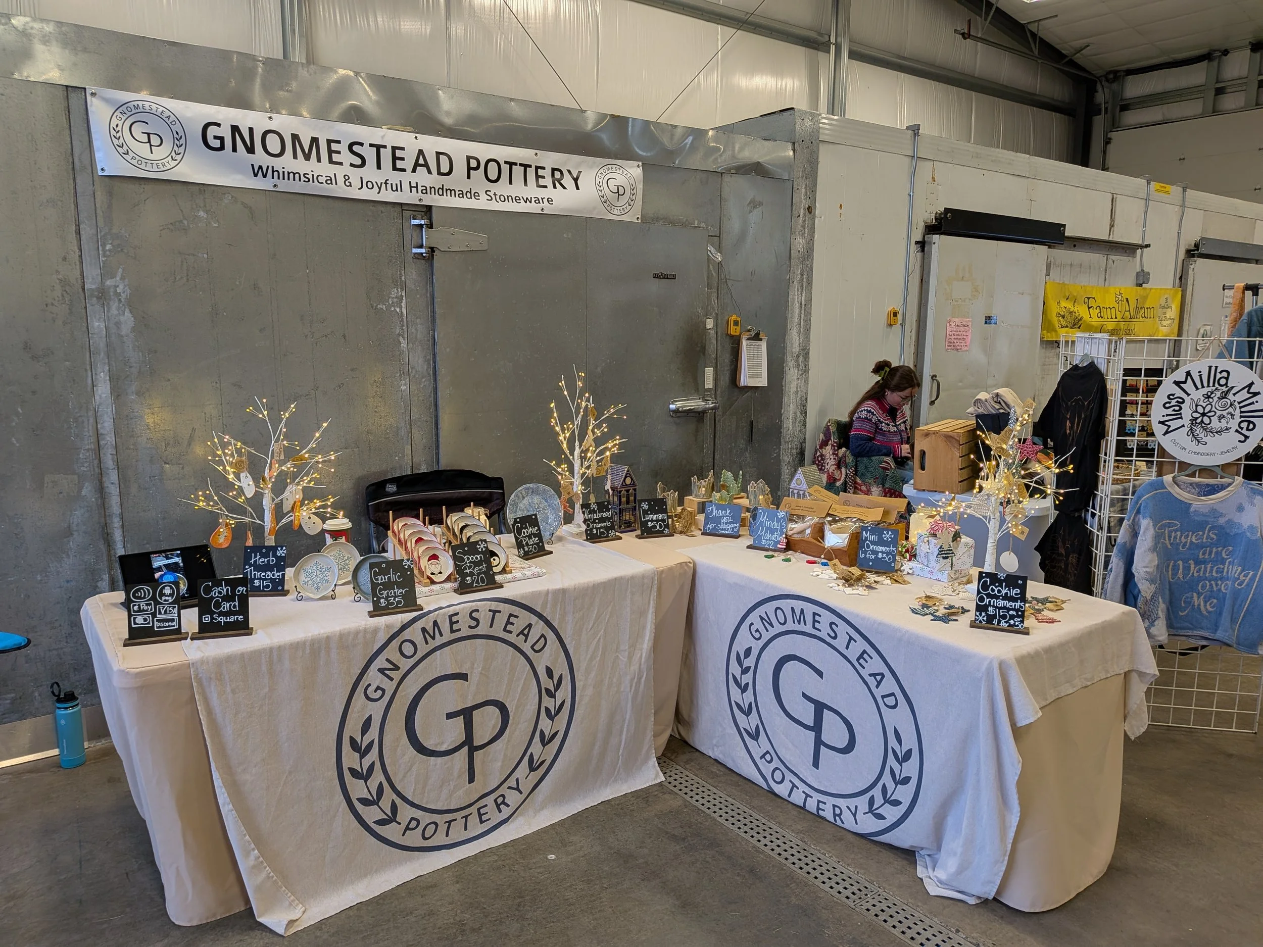 Booth setup showing pottery display at the Stanwood Farmers Market Holiday Fair