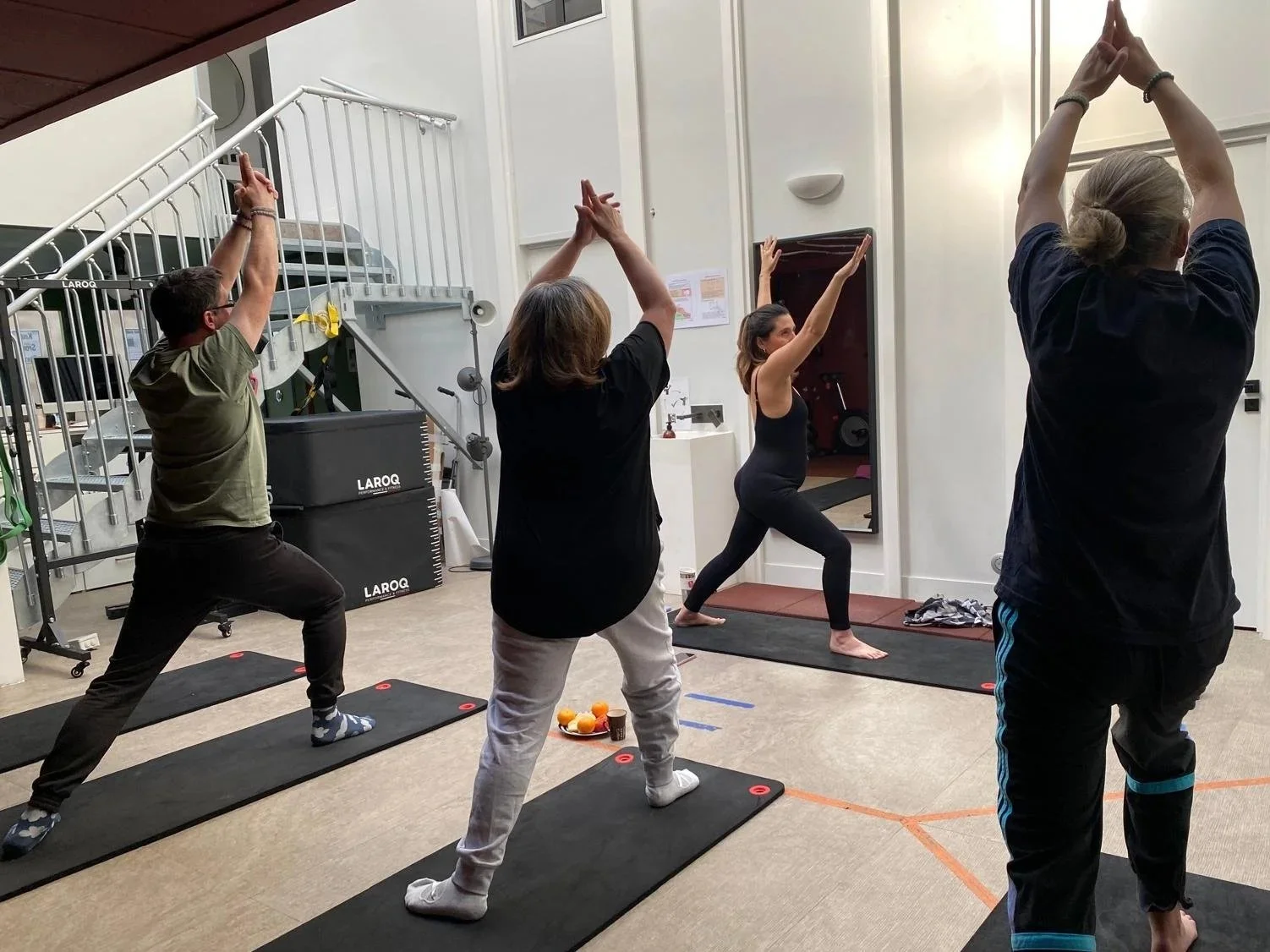 Man standing outdoors with eyes closed, practicing calm breathing in nature.