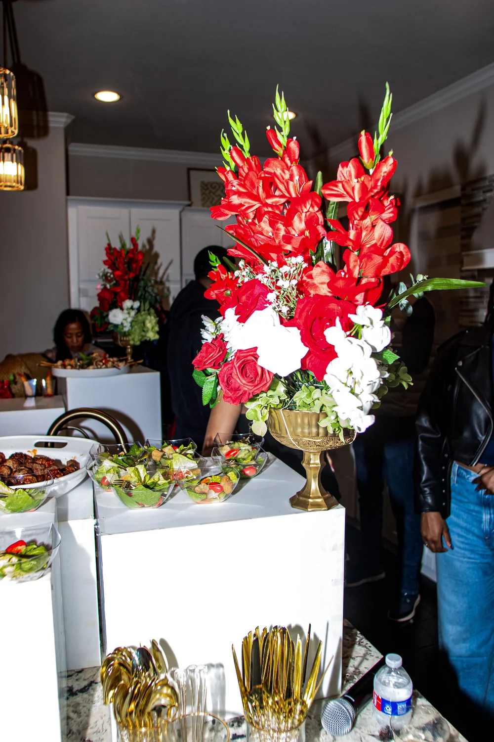 Tall floral arrangement at event Oak and Magnolia Events