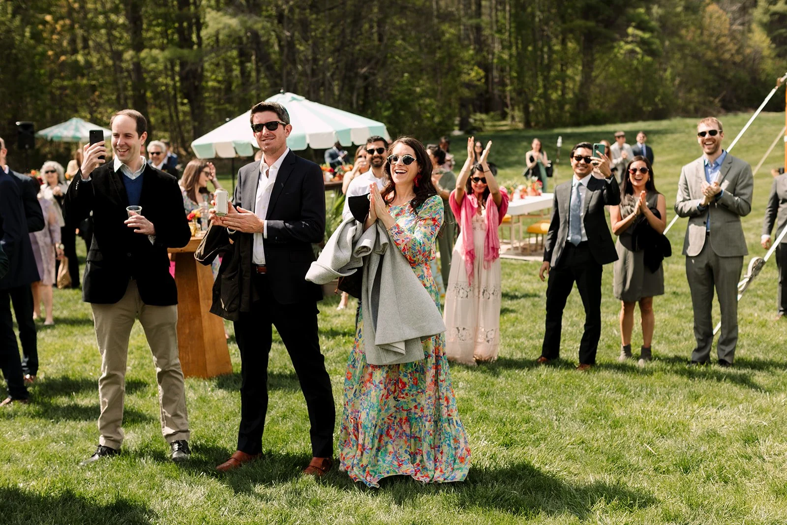Guest celebrate at cocktail hour spring wedding in Maine
