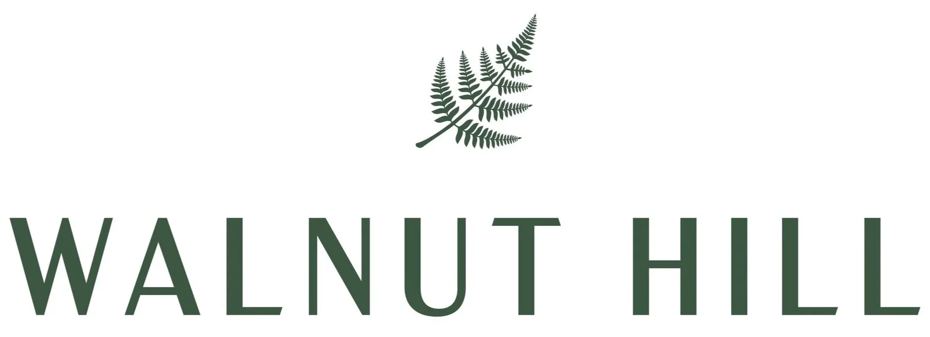 Logo for Walnut Hill featuring a green fern leaf above the text Walnut Hill in large green letters.