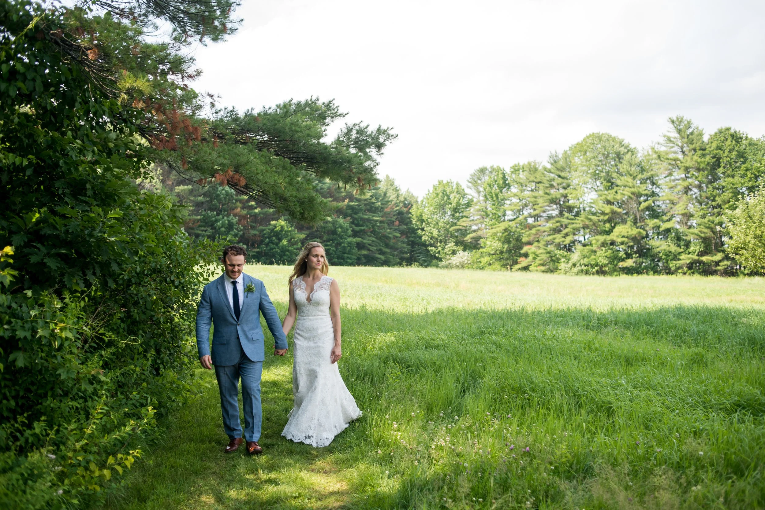 Owners Mike & Essie walk in the meadow at Flanagan Farm